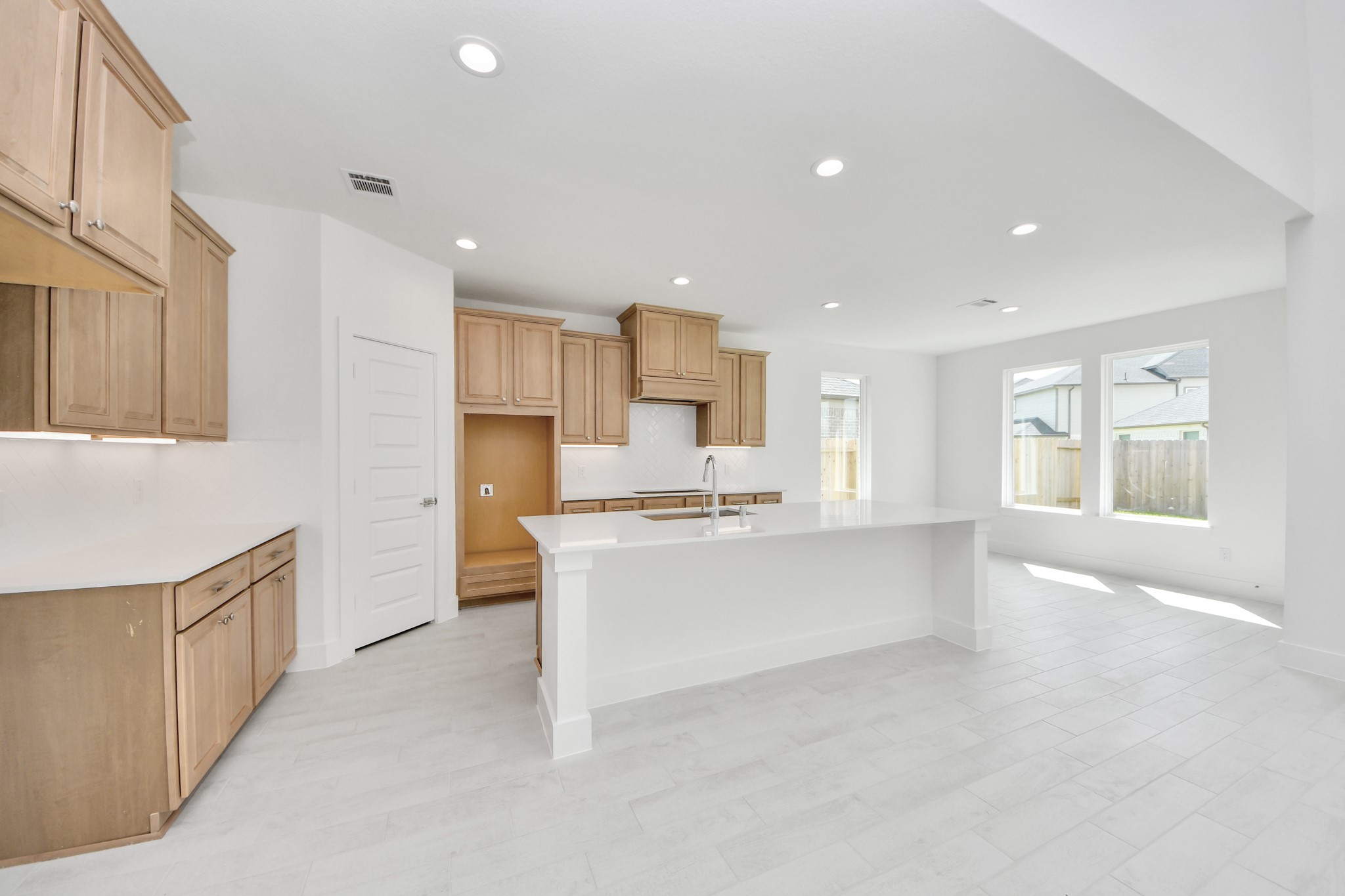 This kitchen is by far any chefs dream! This spacious kitchen features high ceilings, light stained wood cabinets, granite countertop, SS appliances, modern tile backsplash, recessed lighting, extended counter space, granite kitchen island, and space for breakfast bar, and a walk-in pantry all overlooking your huge family room. Sample photo of completed home with similar floor plan. Actual colors and selections may vary. This kitchen is by far any chefs dream! This spacious kitchen features high ceilings, light stained wood cabinets, granite countertop, SS appliances, modern tile backsplash, recessed lighting, extended counter space, granite kitchen island, and space for breakfast bar, and a walk-in pantry all overlooking your huge family room. Sample photo of completed home with similar floor plan. Actual colors and selections may vary.