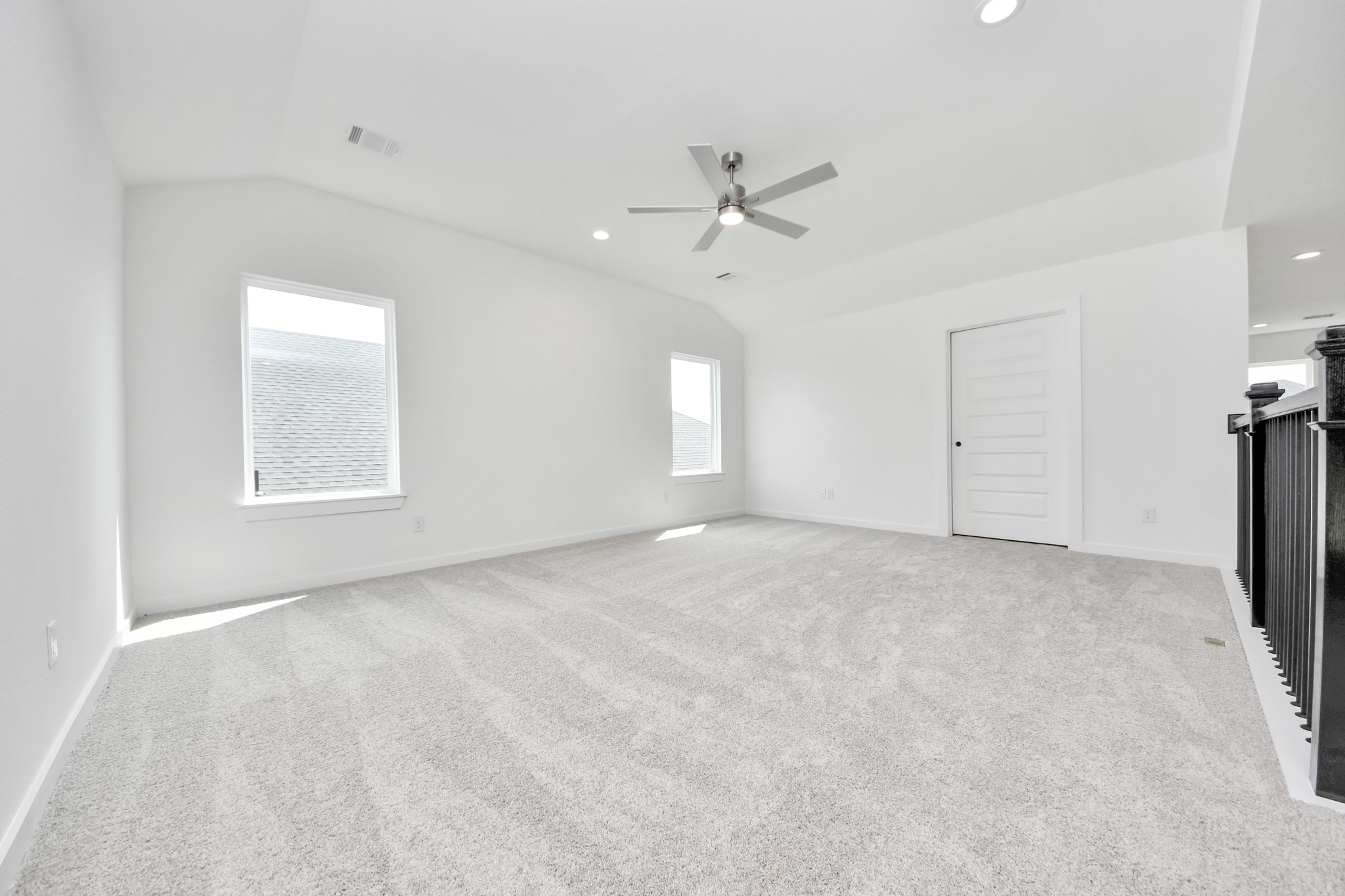 Come upstairs and enjoy a day of leisure in this fabulous game room! This is the perfect hangout spot or adult game room! Features plush carpet, high ceilings, custom paint and windows for plenty of natural light. Sample photo of completed home with similar floor plan. Actual colors and selections may vary.