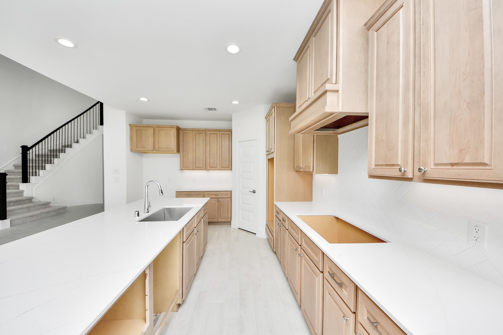 The open concept effortlessly connects the kitchen to the expansive family room, forming a perfect hub for gatherings. This seamless flow creates an inviting space where cooking and socializing come together harmoniously. Sample photo of completed home with similar floor plan. Actual colors and selections may vary.