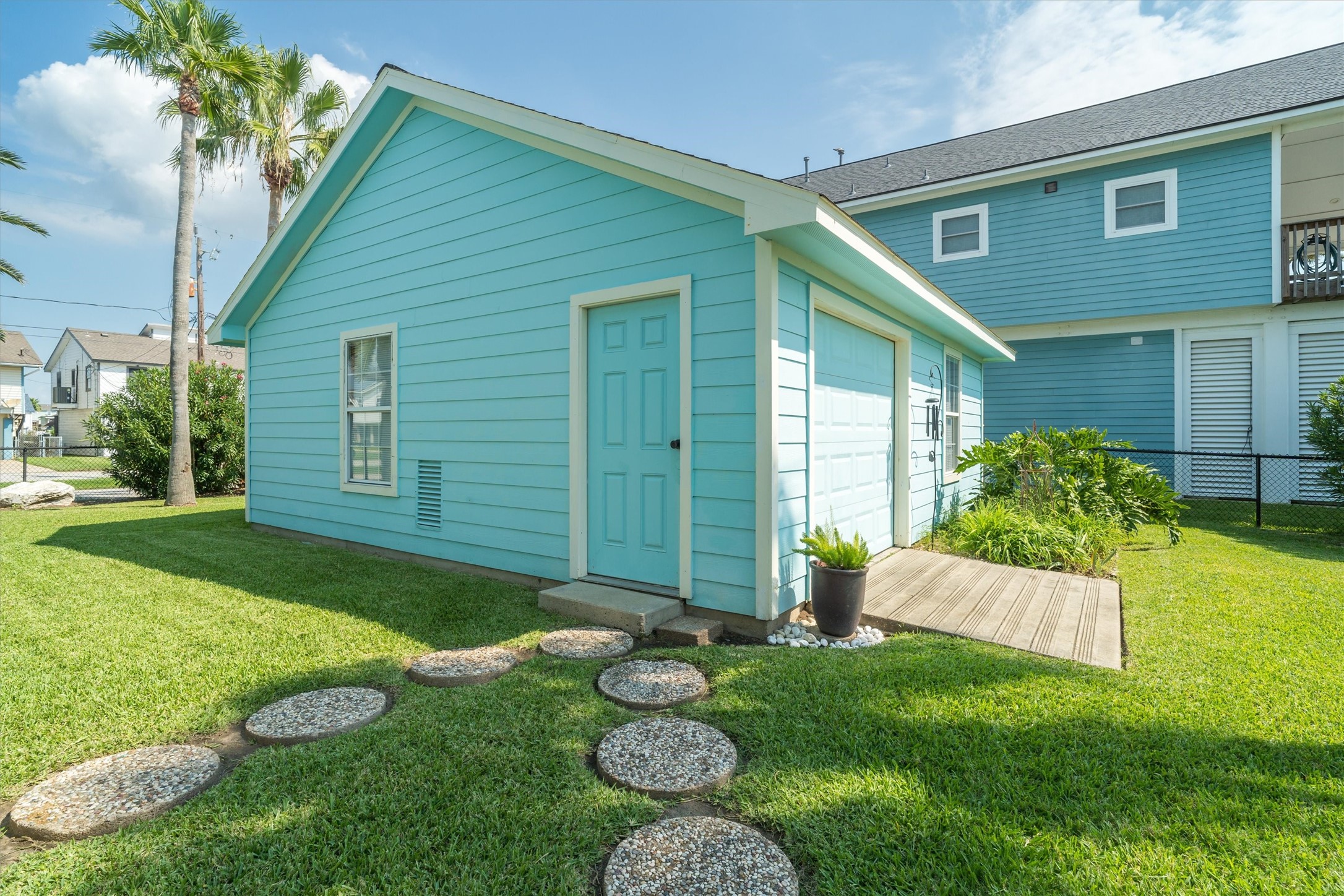 The garage is perfect as a workshop area. There are double doors on the street side and water side which allows for a nice breeze inside while you're working