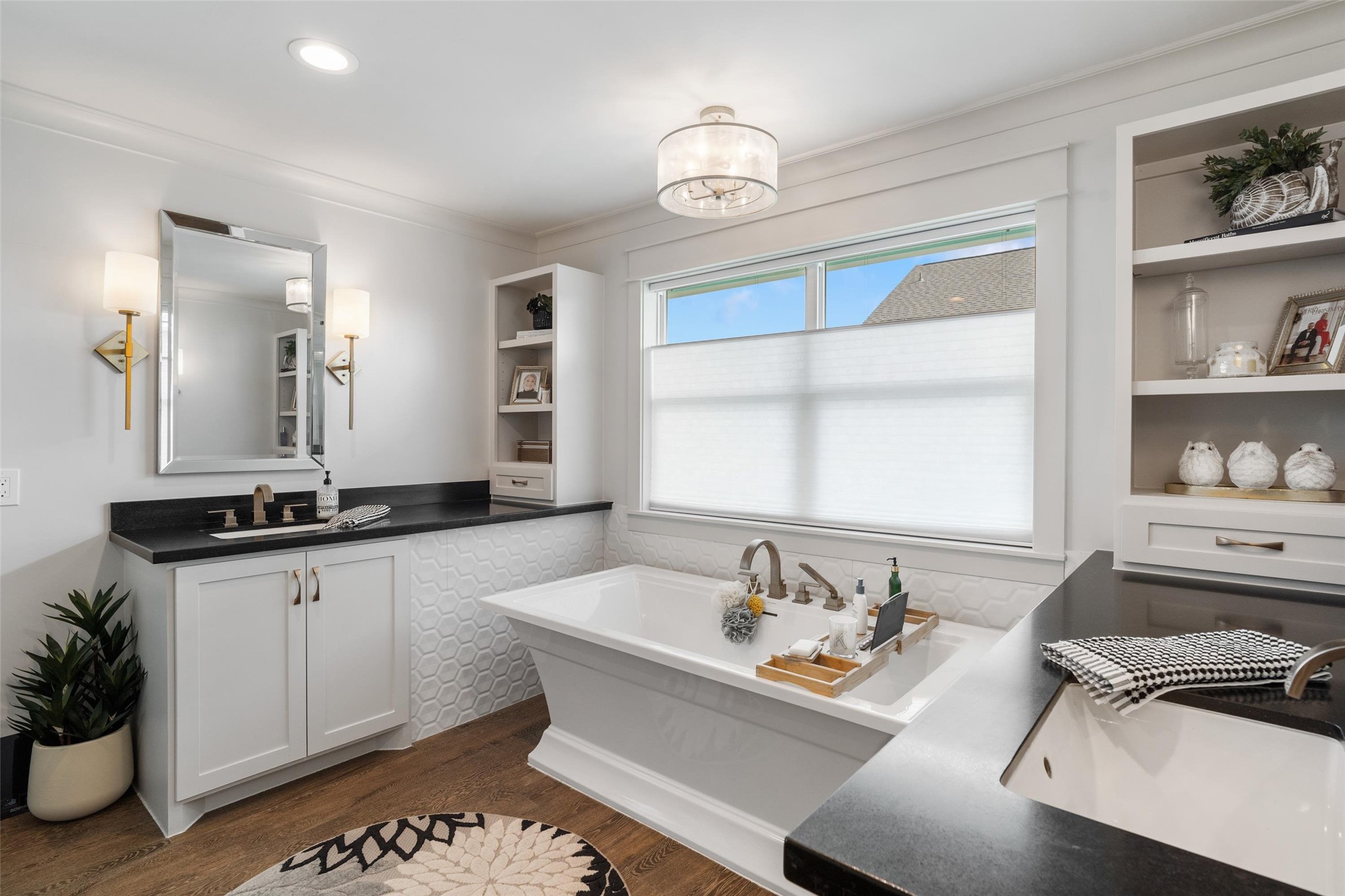 Elegant primary ensuite showcasing dual vanity areas with ample storage, a luxurious soaking tub for unwinding, and a beautifully designed layout that blends style with spa-like comfort