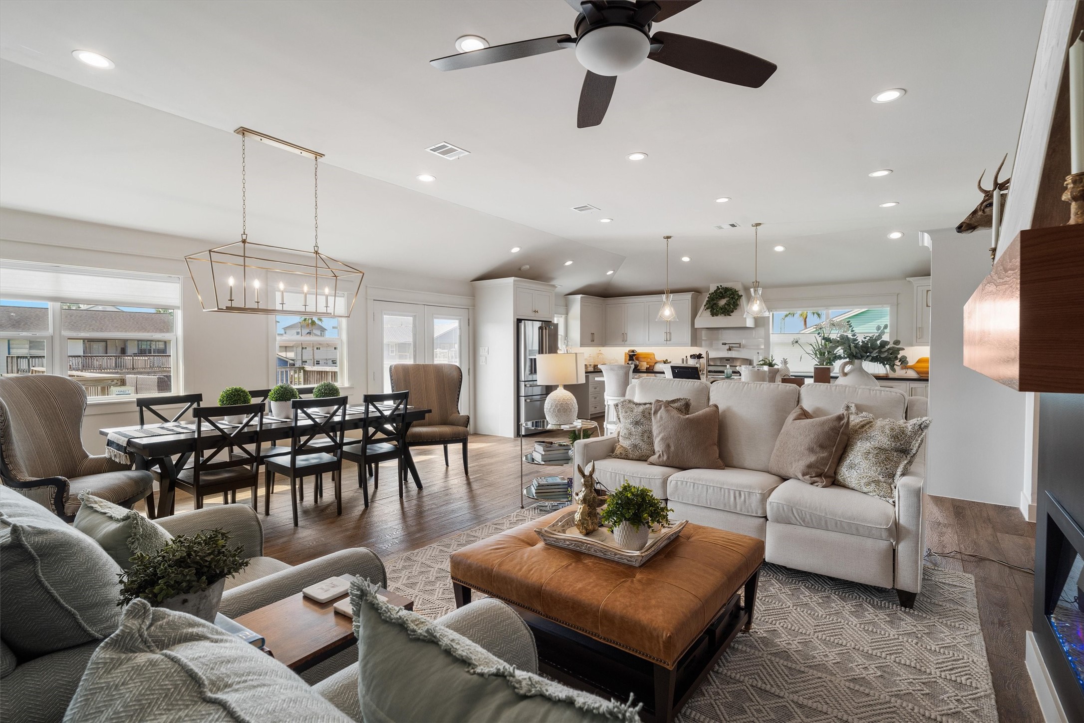 View from the living room of the dining room and kitchen. The raised ceiling is very obvious in this picture and gives this home a stylish finish