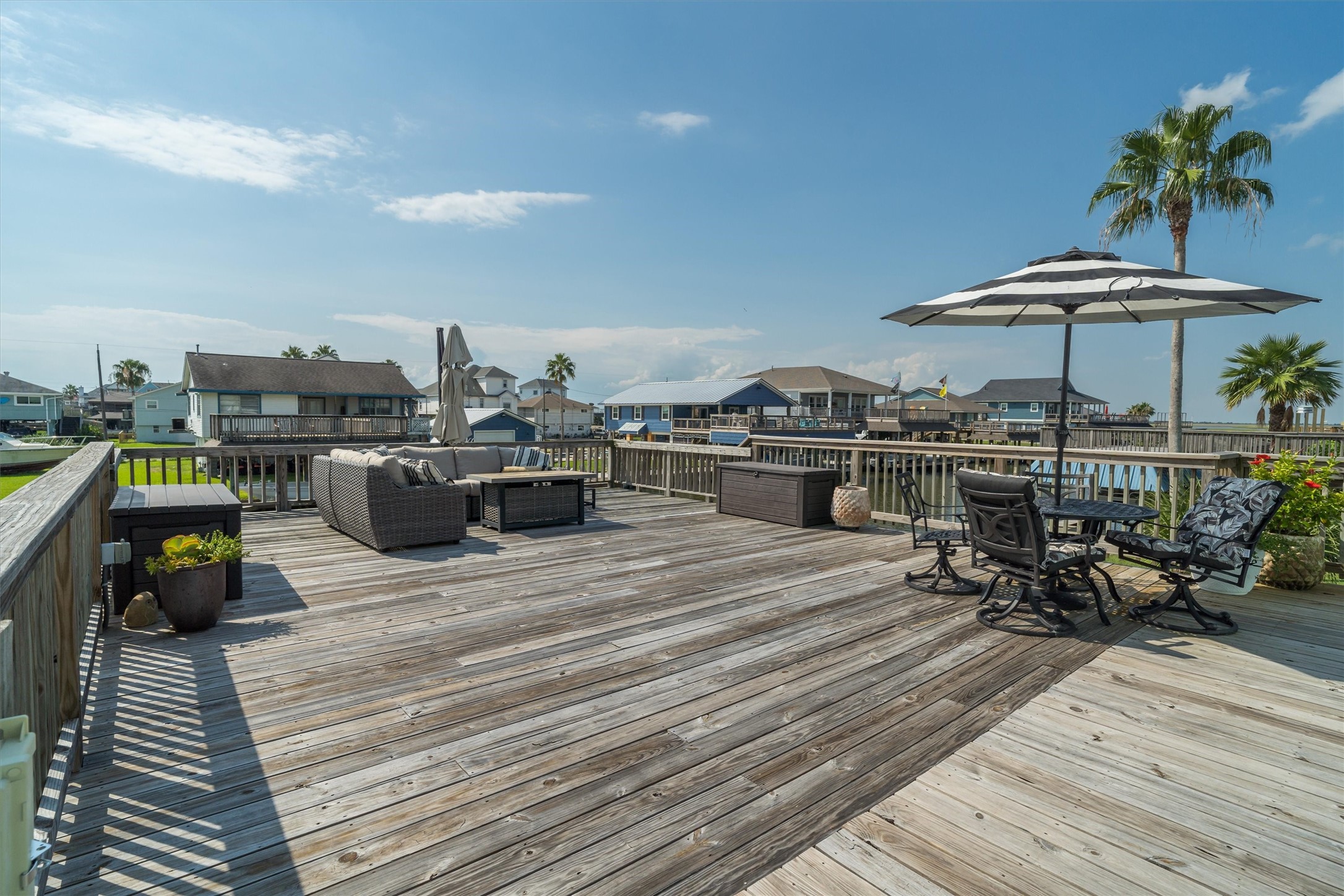 The large upper party deck is perfect for entertaining, outdoor dining, relaxing with friends, or enjoying water views. This versatile space invites gatherings, celebrations, and peaceful moments in the open air