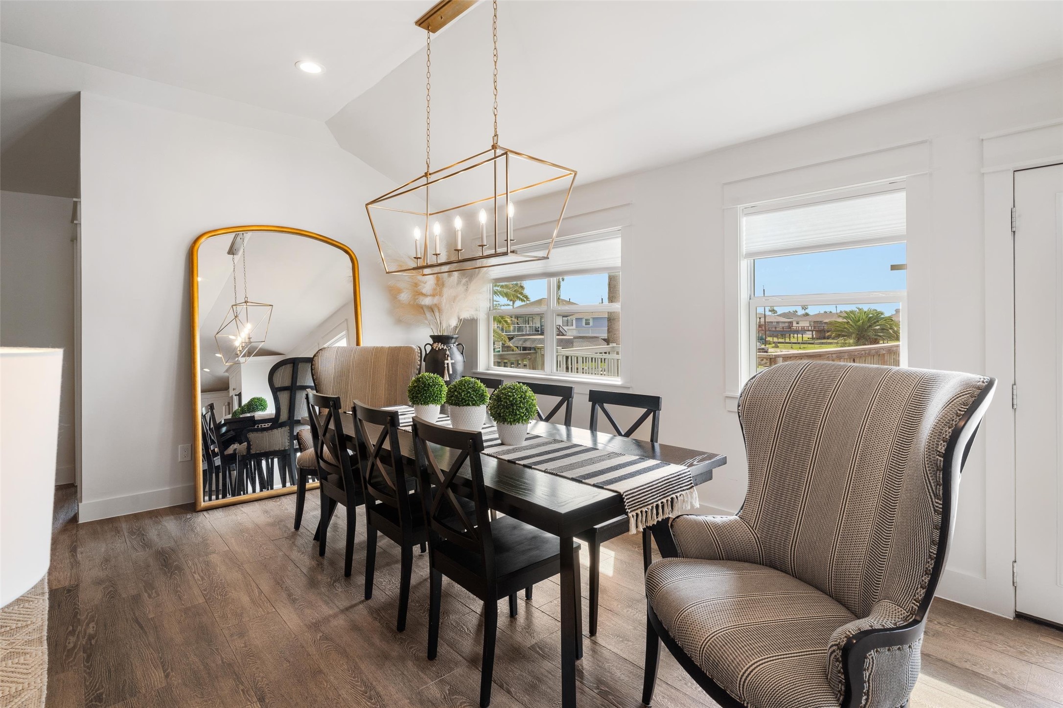 The dining area is on the waterside of the home. Notice the high ceilings that the sellers added to the home. Family and friends will enjoy great meals in this area