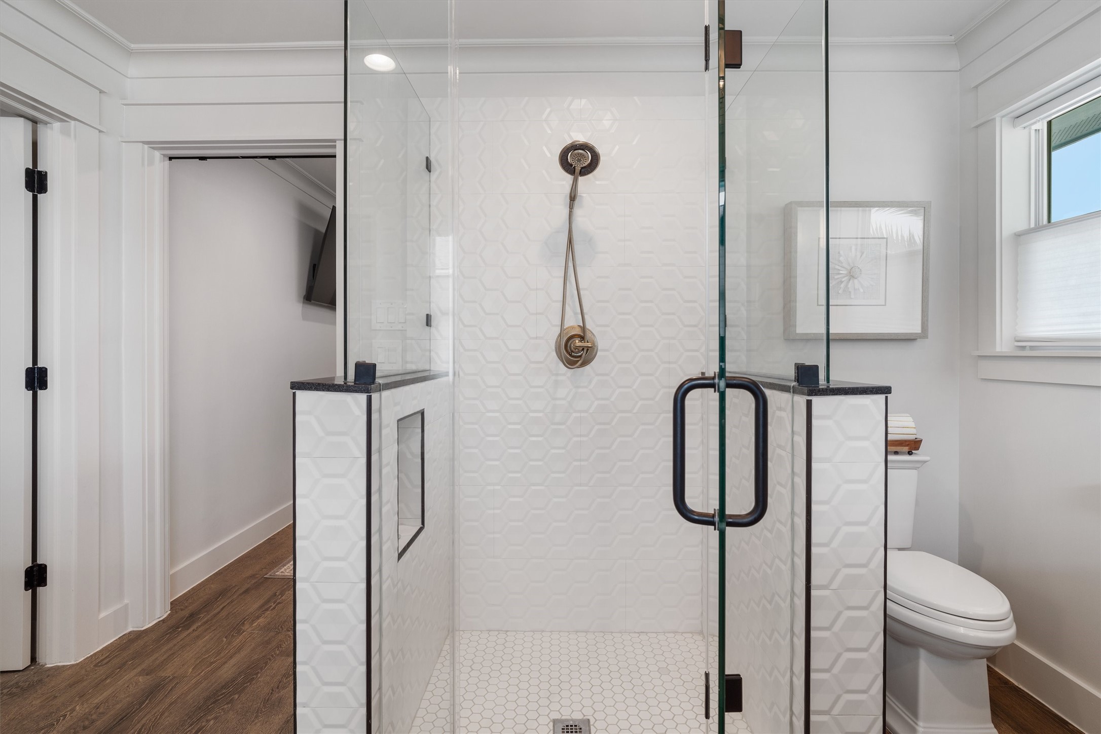 Custom-designed oversized walk-in shower featuring sleek tile work, glass enclosure, and a spacious spa-inspired design that brings both luxury and comfort to everyday living