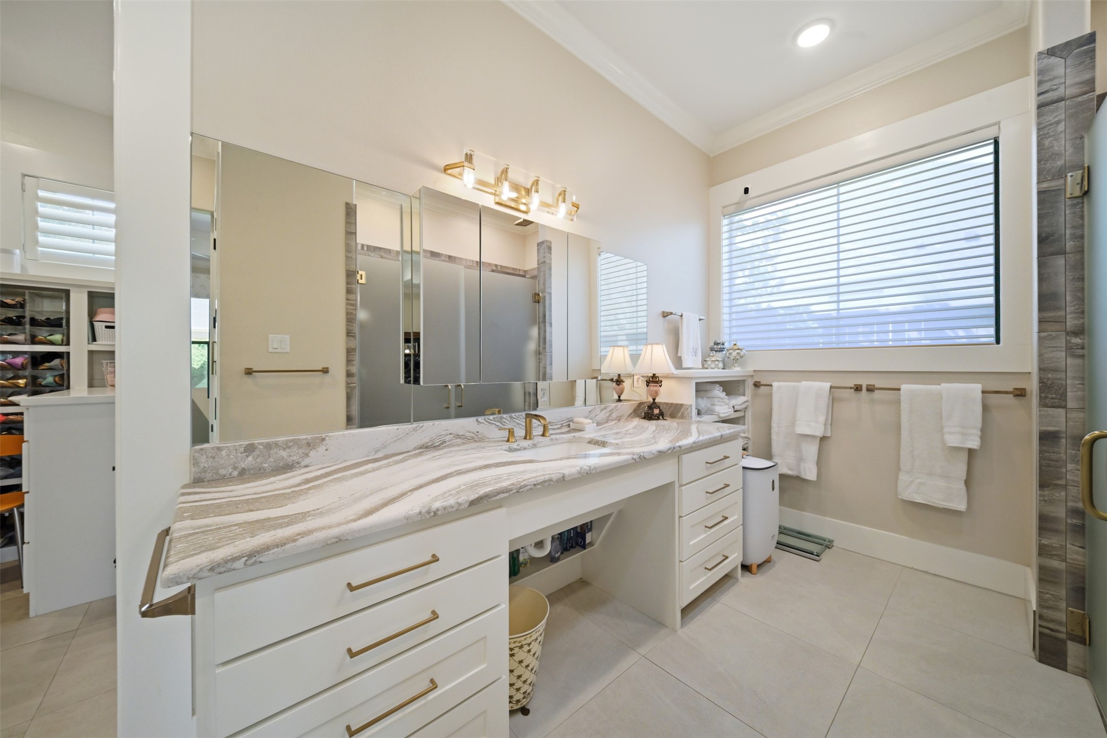 Second separate vanity in the primary bath offers generous counter space and additional storage.