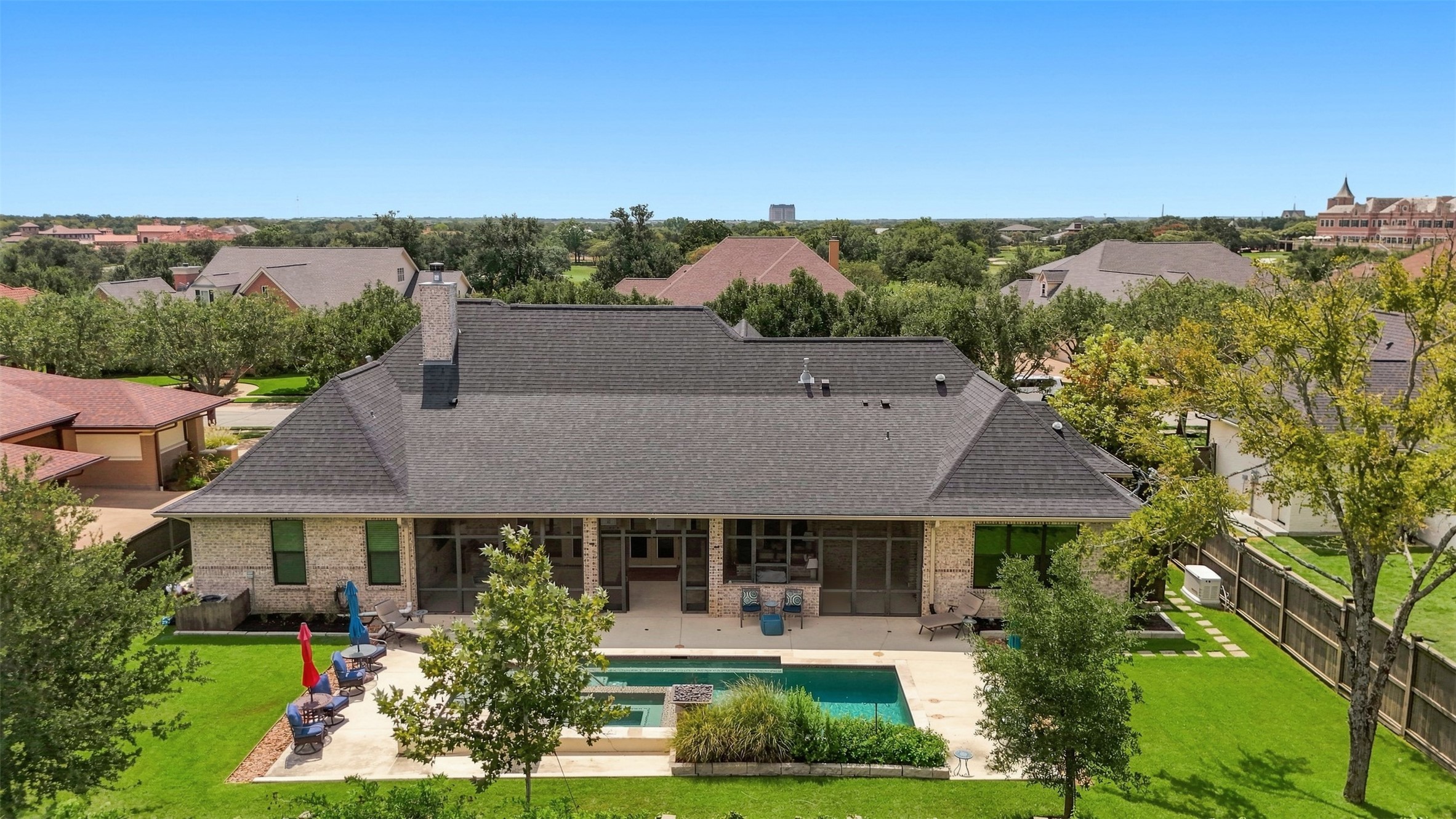 Aerial view showcasing the homes expansive backyard, pool, screened porch and surrounding green space. Aerial view showcasing the homes expansive backyard, pool, screened porch and surrounding green space.