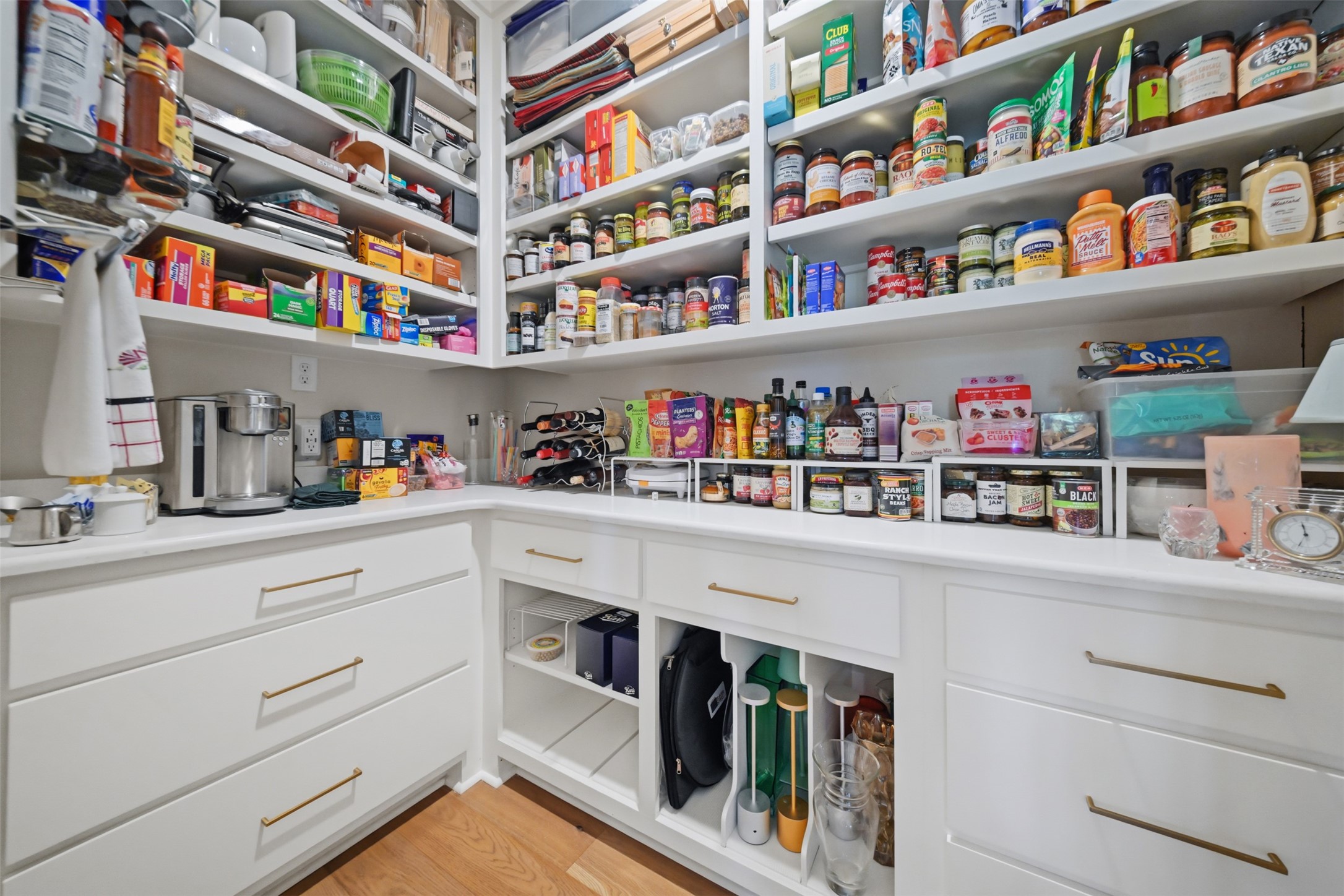 Butlers pantry offering abundant custom storage and thoughtful organizational features.