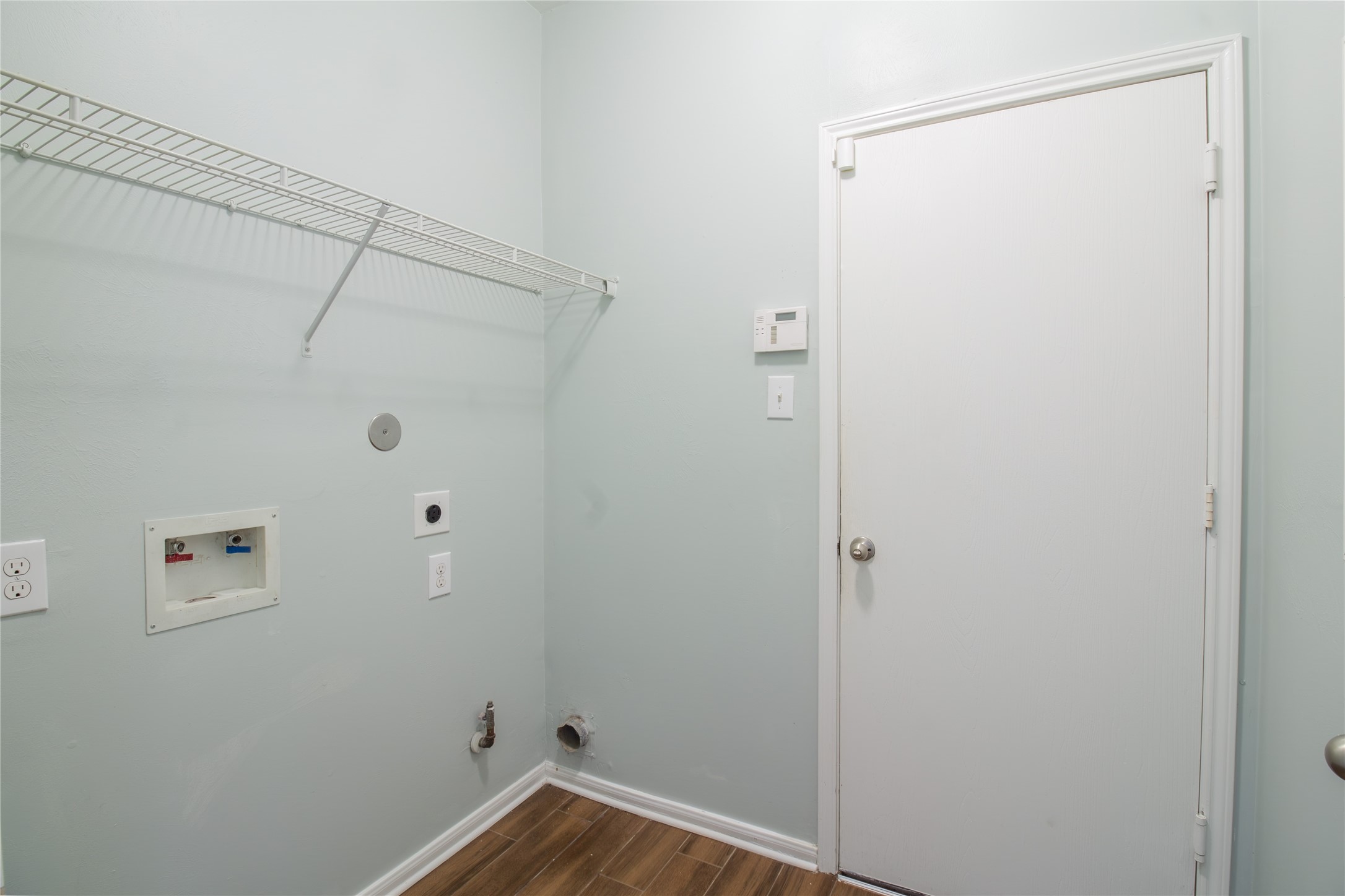Conveniently located on the first floor, the utility room offers both gas and electric dryer connections to accommodate your laundry preferences.