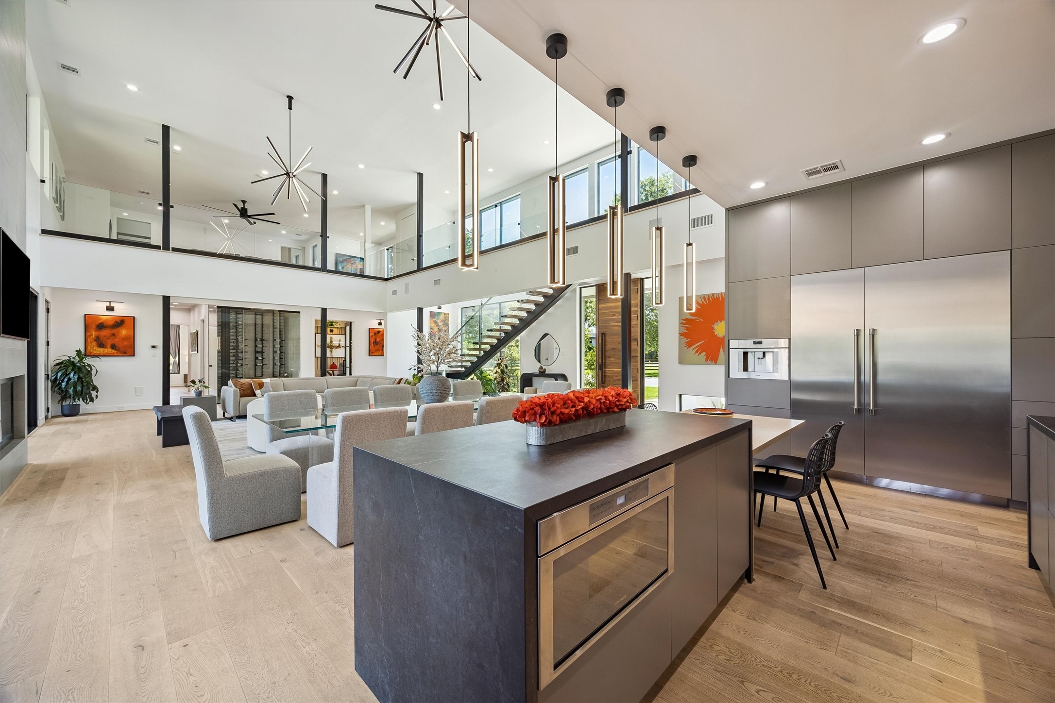 A striking oversized island anchors the chef's kitchen, where sophisticated cabinetry, premium appliances, and an open connection to the great room make everyday living and entertaining equally enjoyable.
