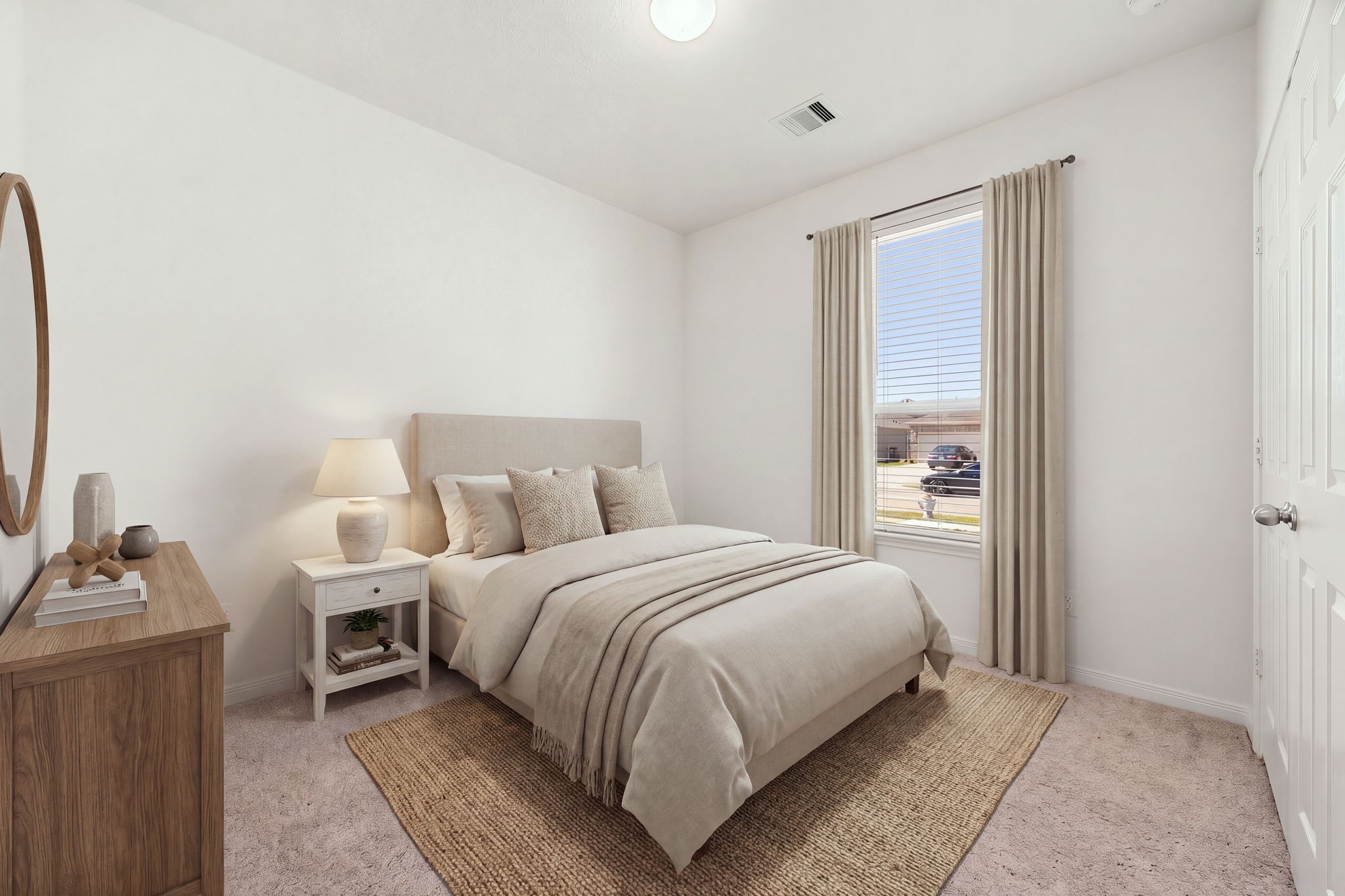 A beautifully lit secondary bedroom conveniently located near the front entryway. High ceilings, recessed-style lighting, and a large window equipped with privacy blinds combine comfort and functionality in this flexible space. *Virtually Staged