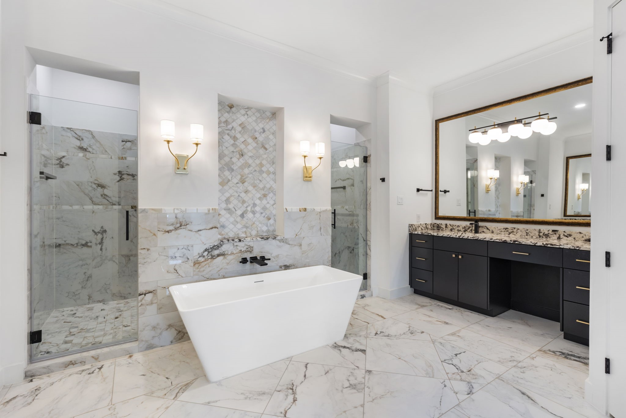 Double entry shower as well as double sinks and a vanity area.