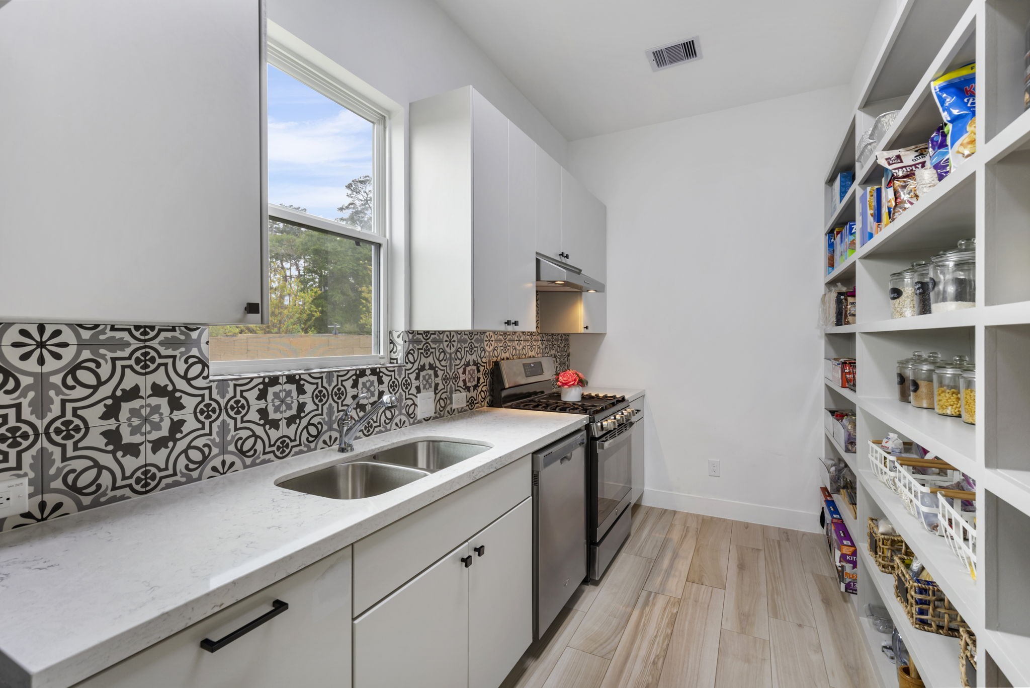Pre-Kitchen equip with sink, gas range and refrigerator.