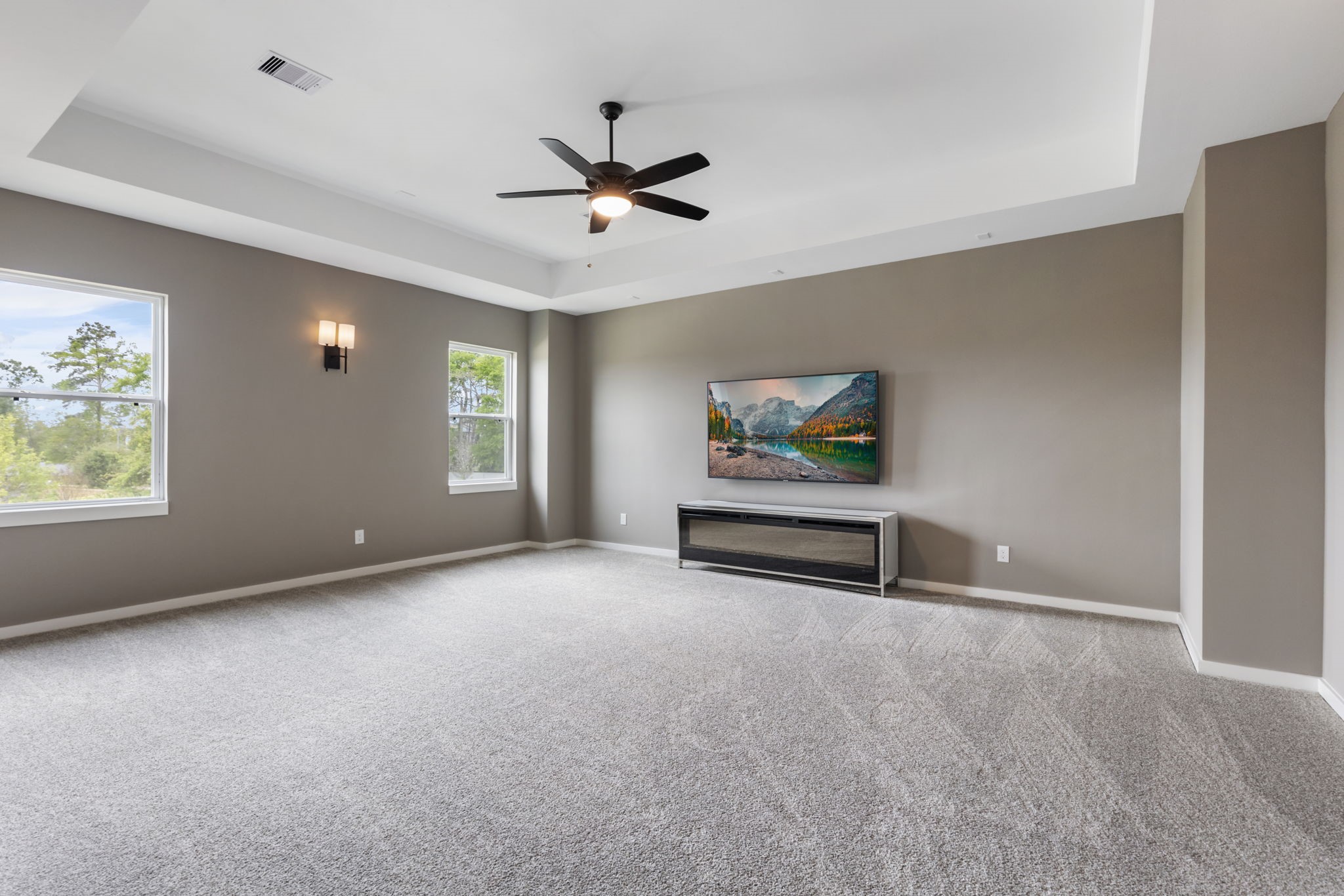 Media room on second floor with tray ceilings.