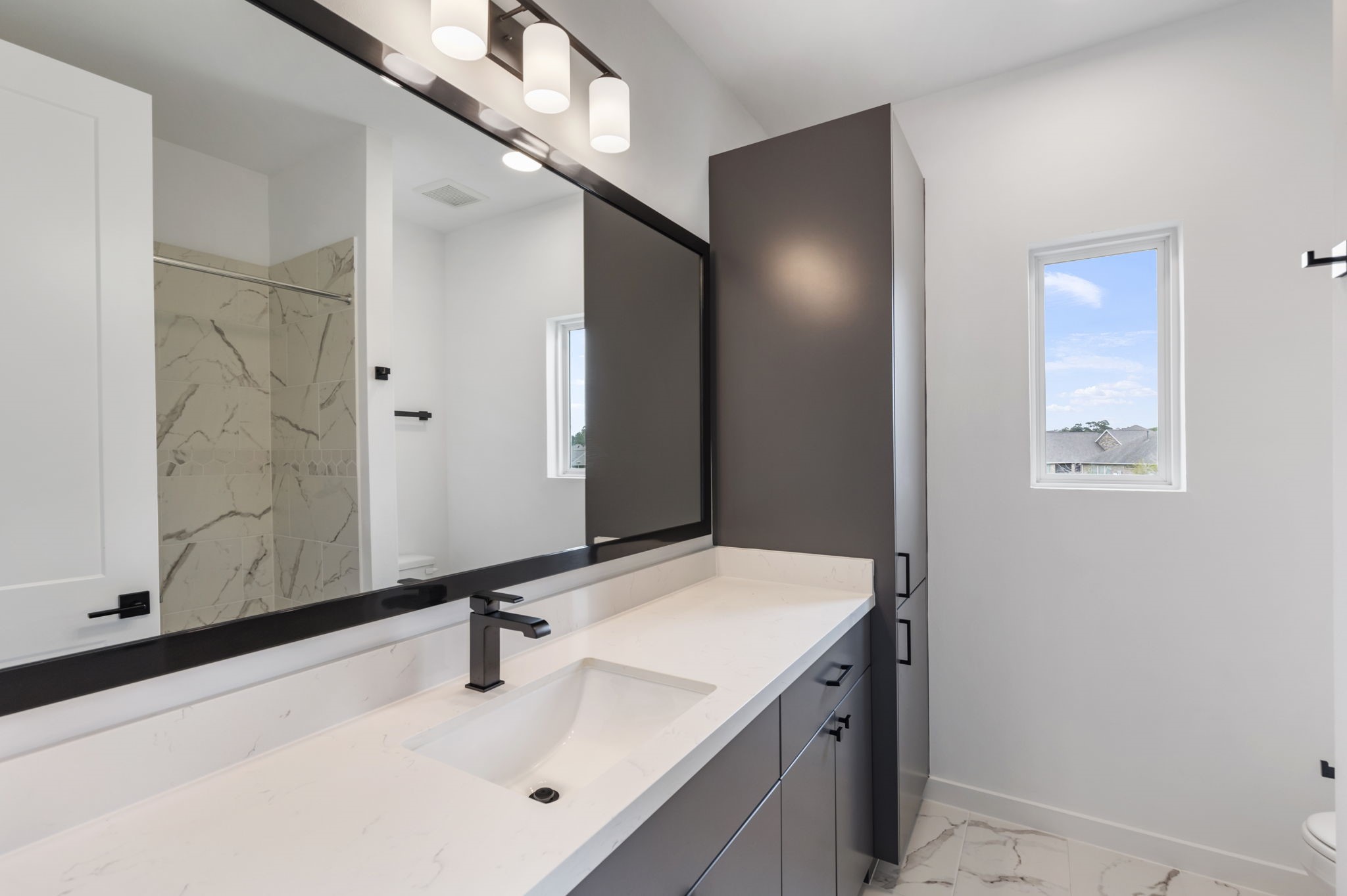 Ensuite with shower and bathtub combo.