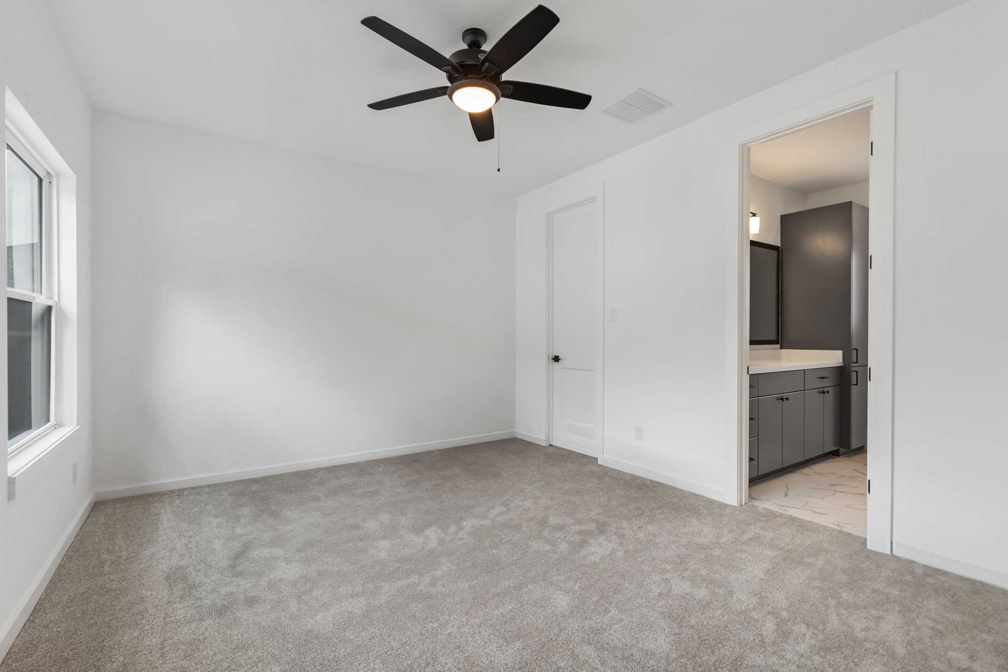 Secondary bedroom with ensuite on second floor.