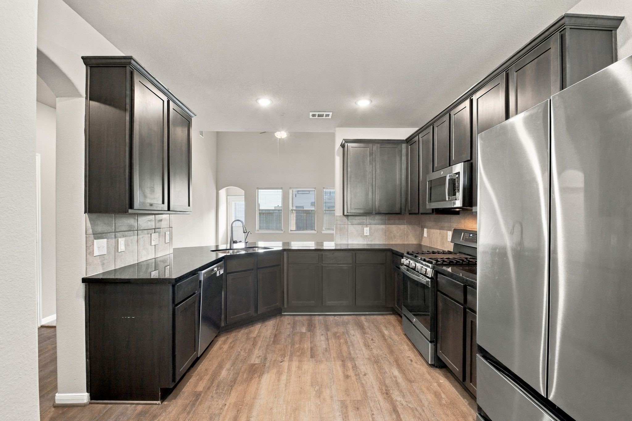 Vinyl plank floor and stainless steel appliances