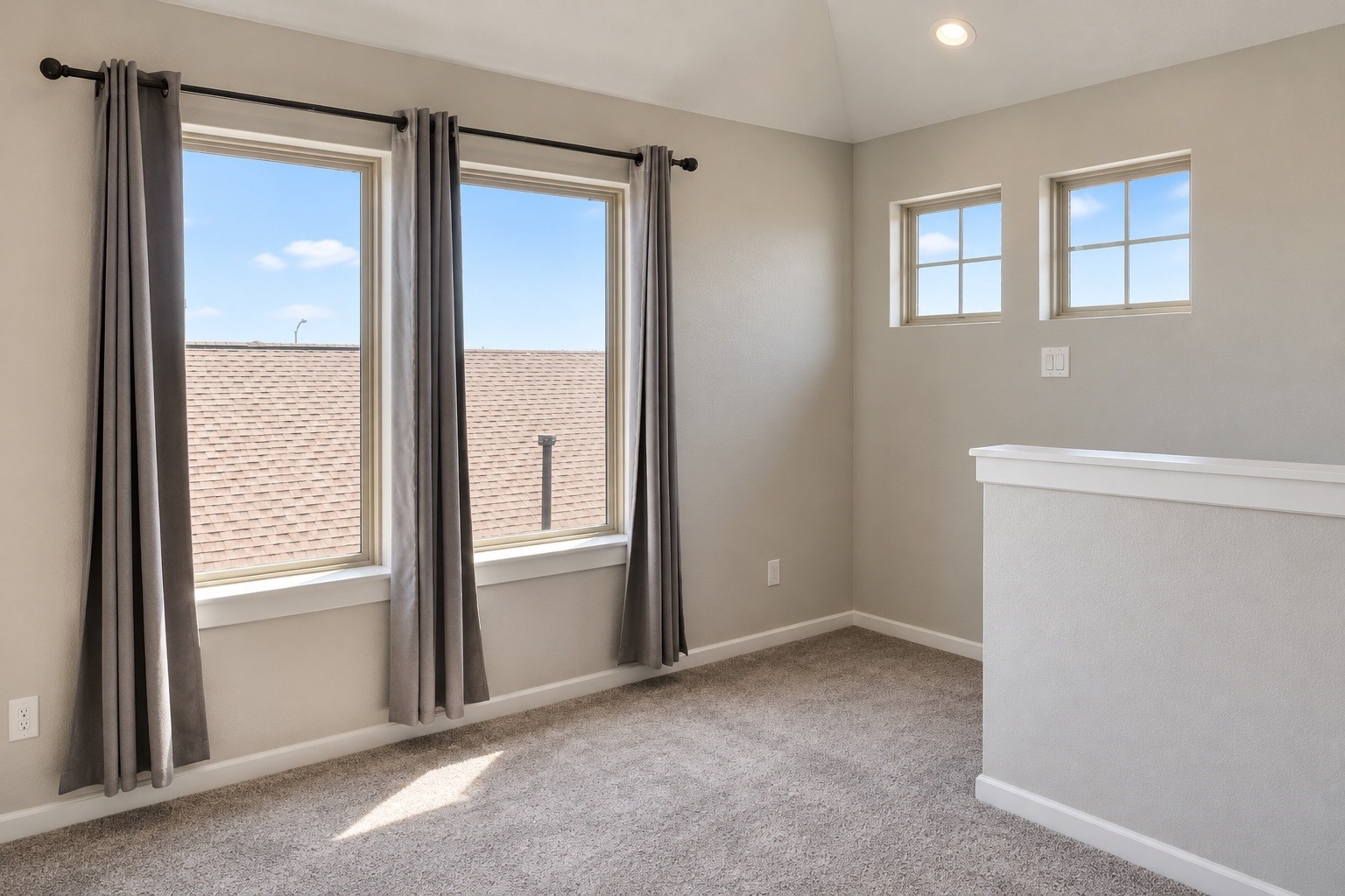 The upstairs loft offers flexible space for a second living area, game room, homework station, or cozy reading retreat.
