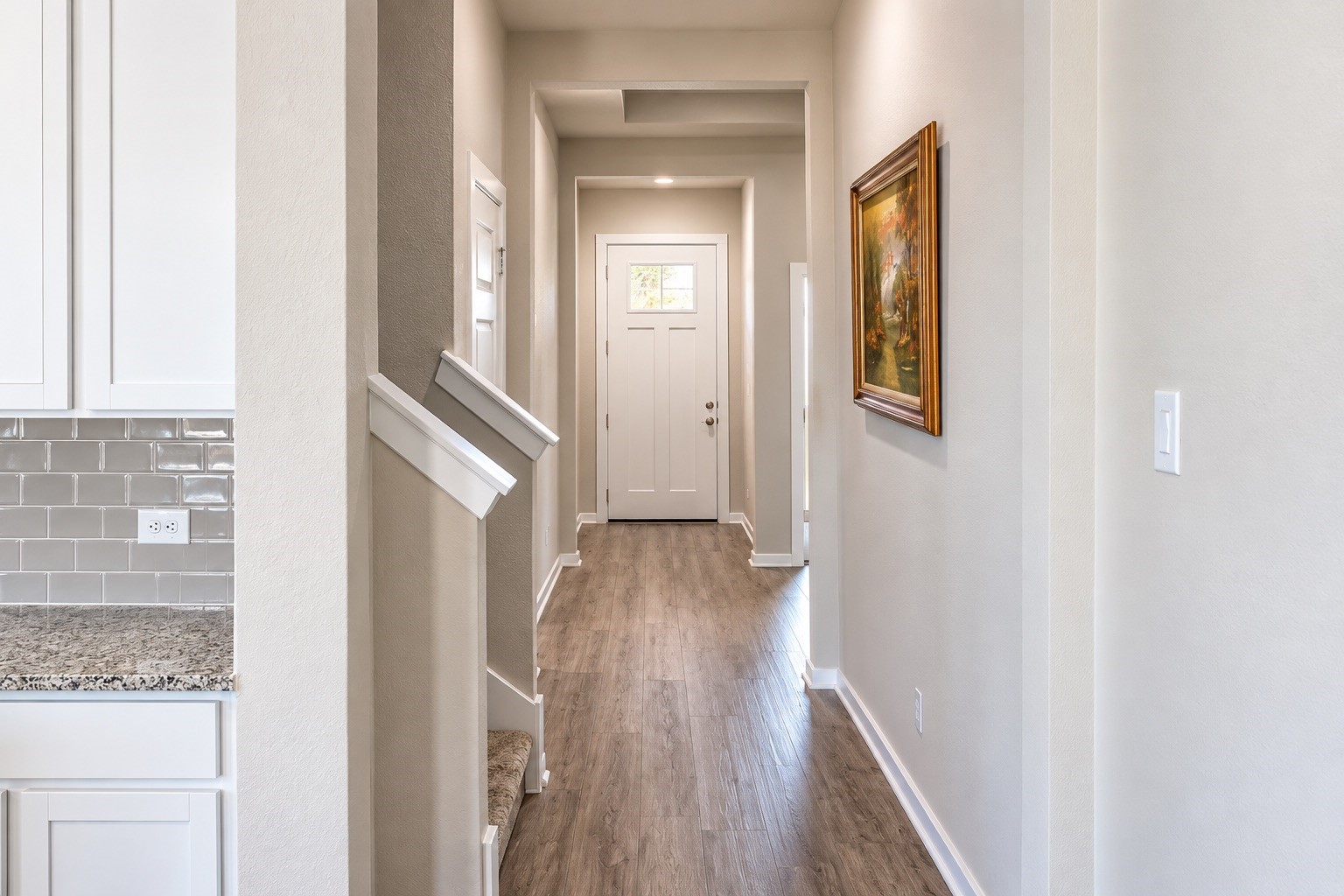 Welcoming entry with attractive flooring and neutral tones, offering a seamless transition to the home's main living areas.