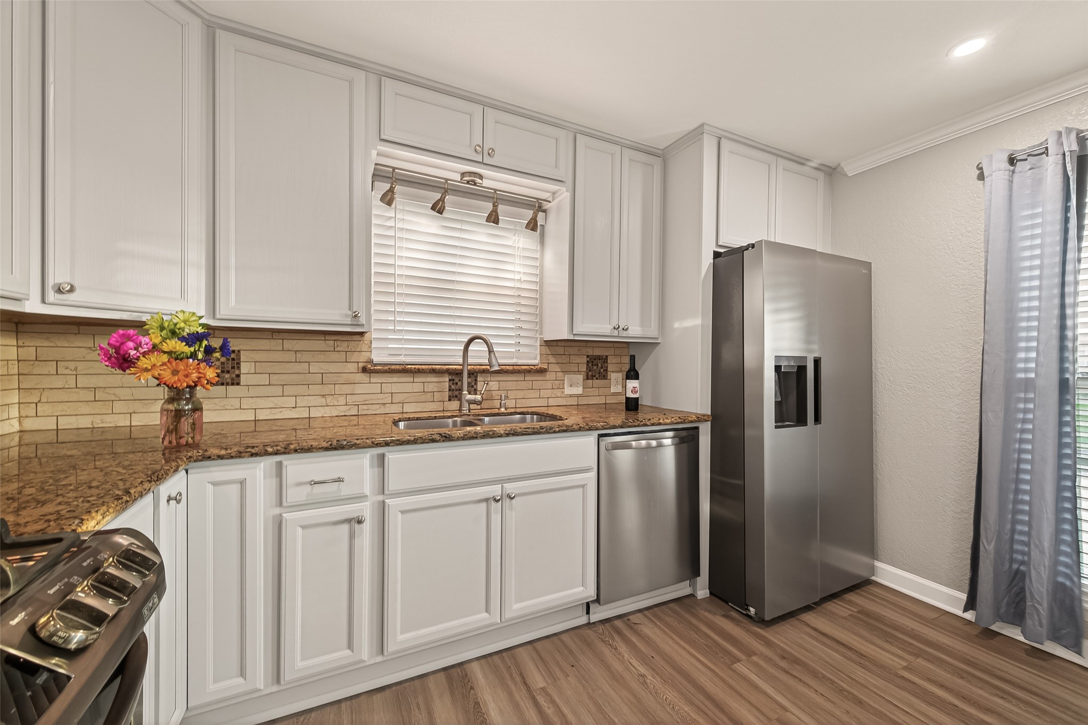 Culinary delights created here!  Refrigerator (2024) stays with the home.  Dishwasher replaced in 2024.
