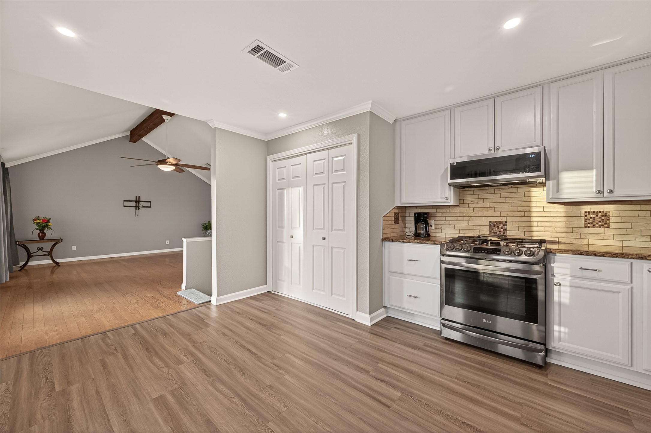 Breakfast/Dining area to the left of picture.  Kitchen/Dining open to the family room.  New microwave in 2025.