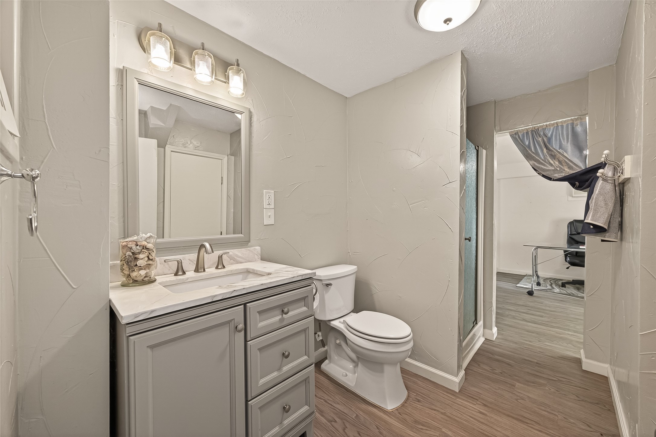 Downstairs full bathroom with walk in shower.