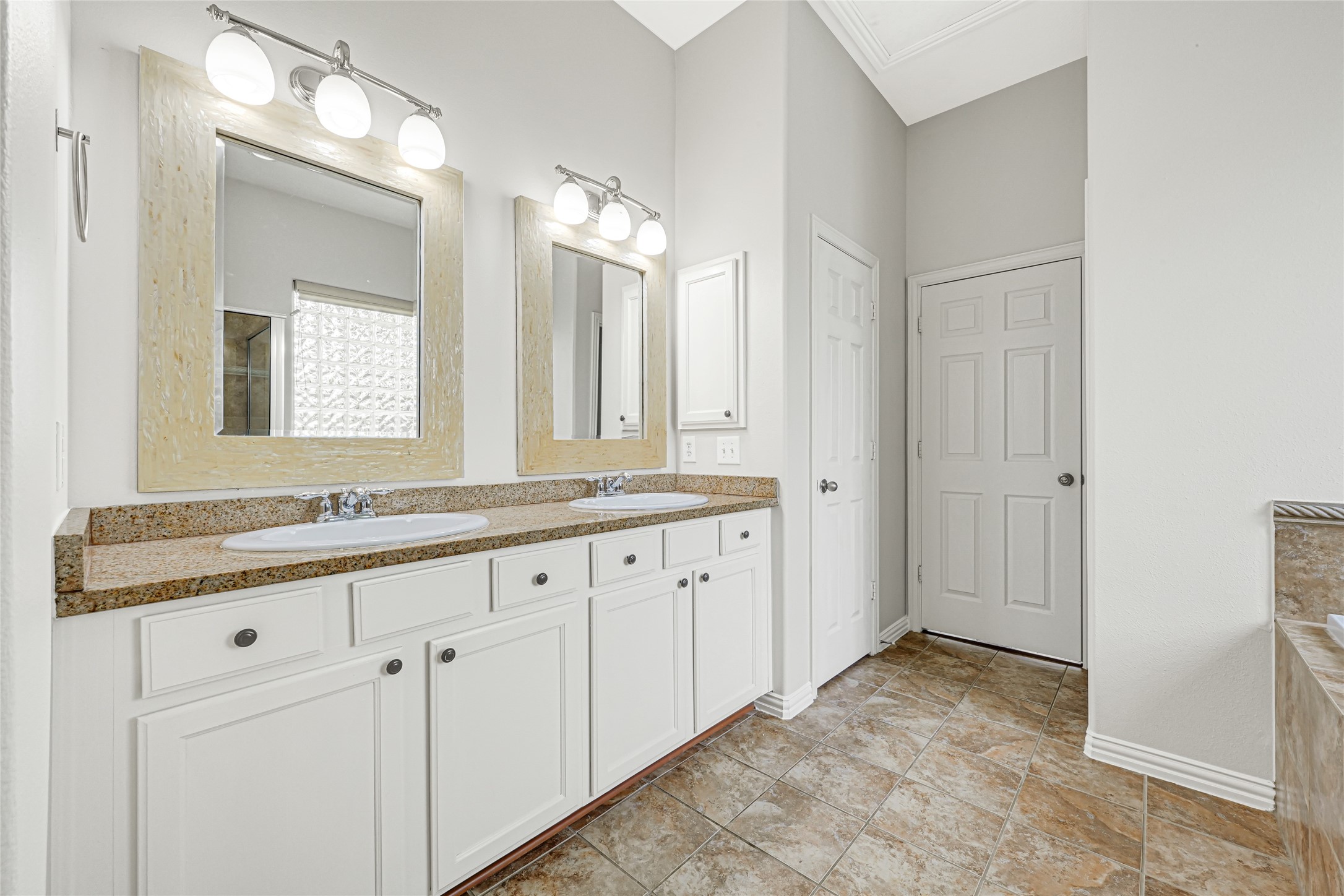 Primary bathroom, double sinks and granite countertops.