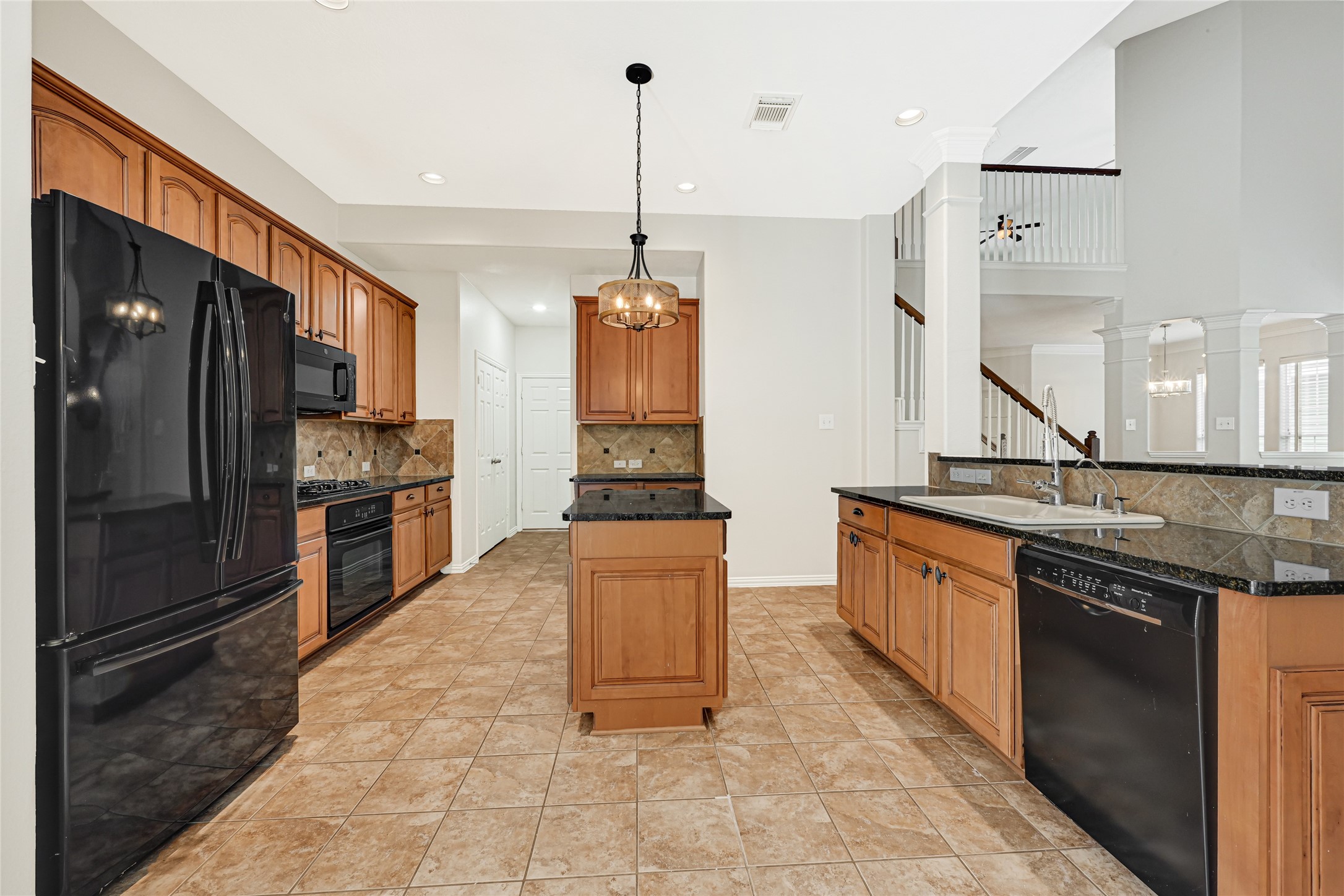 Gourmet kitchen with abundant storage space.