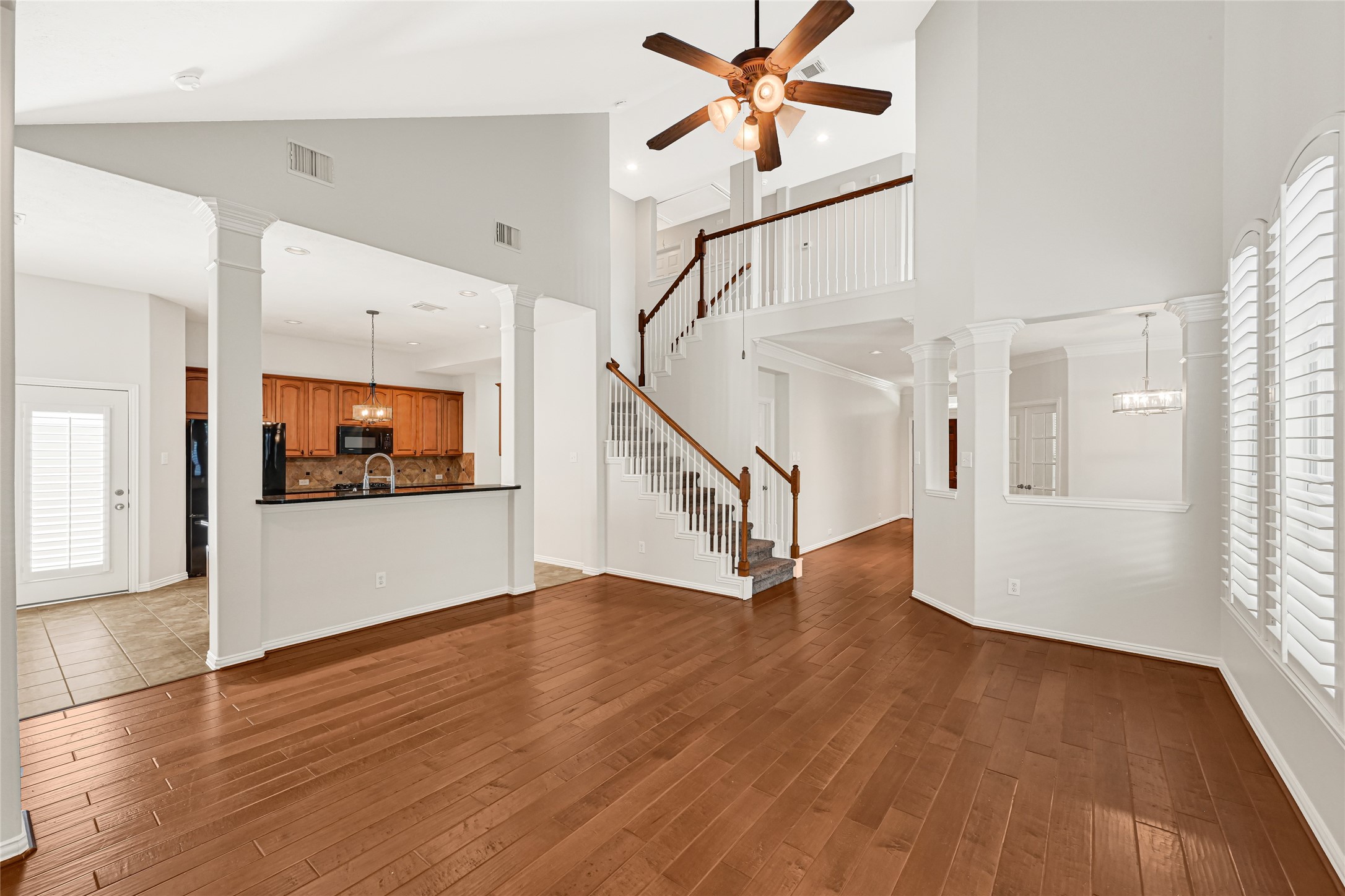 Beautiful staircase with high ceilings and open, spacious feel.