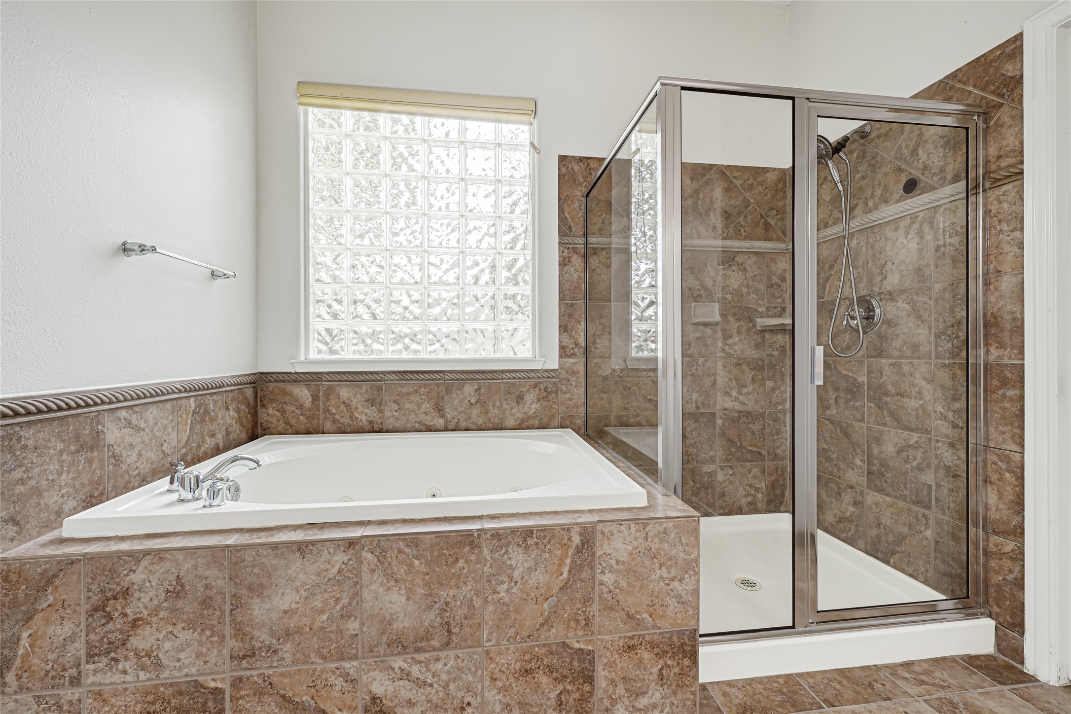 Primary bathroom separate tub and shower.