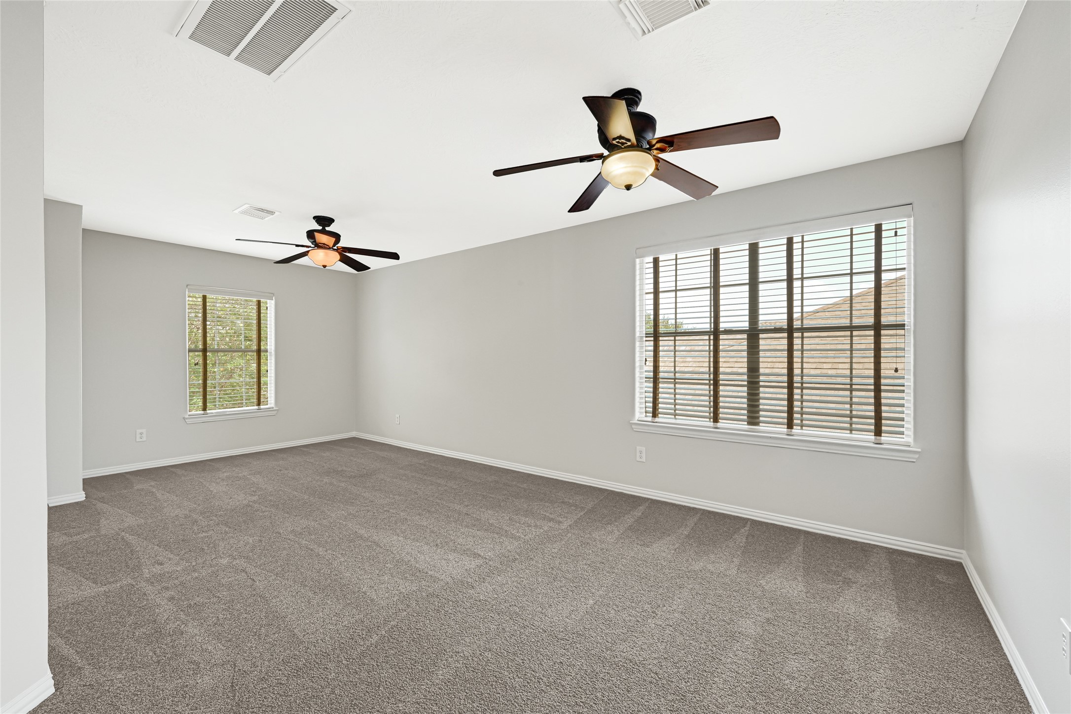 Versatile second-floor bonus room ideal for games or movie nights.