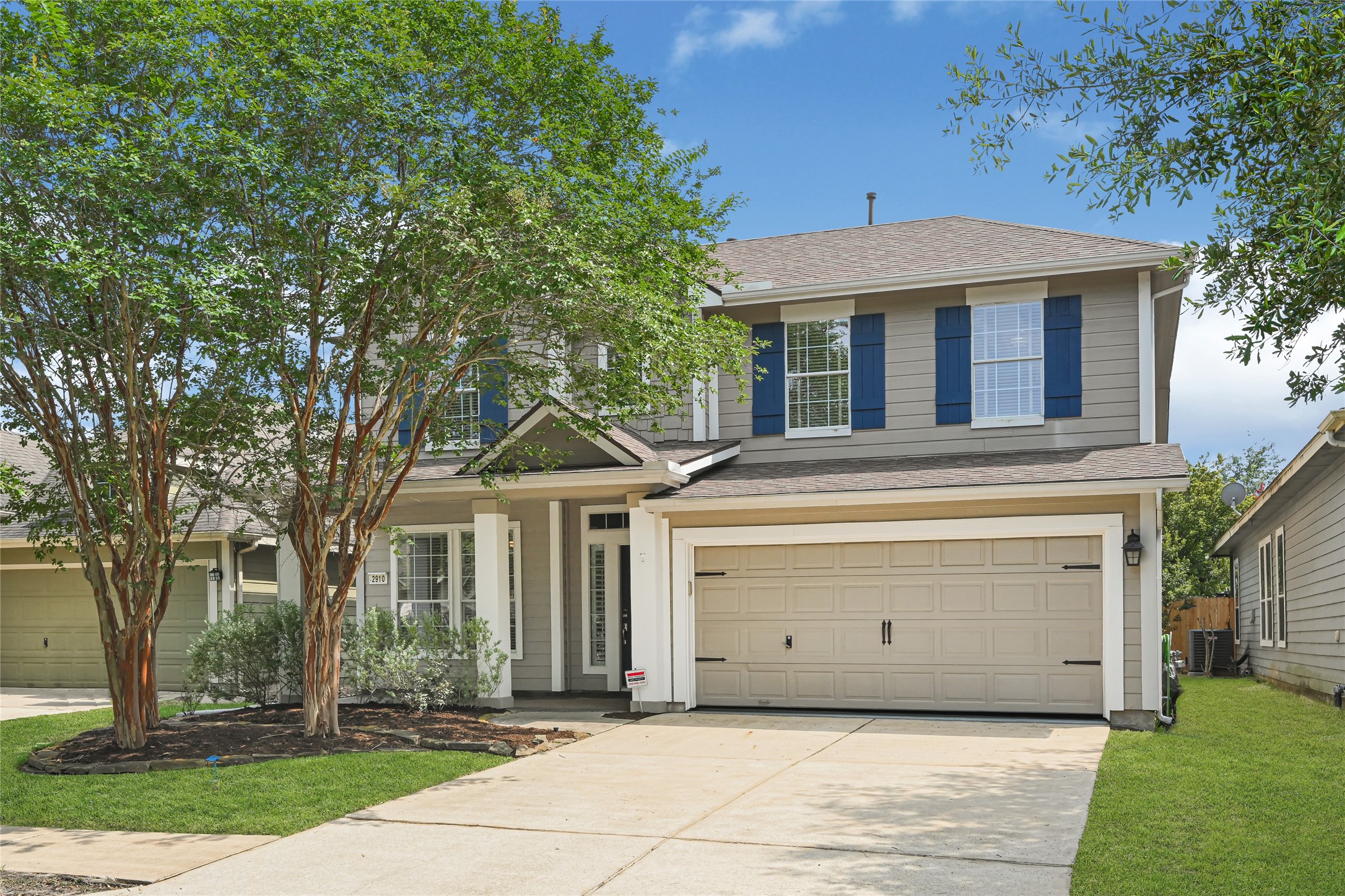 Updated exterior with newly added roof and surrounding greenery.