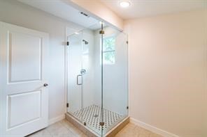 Light and bright shower and bathroom area!