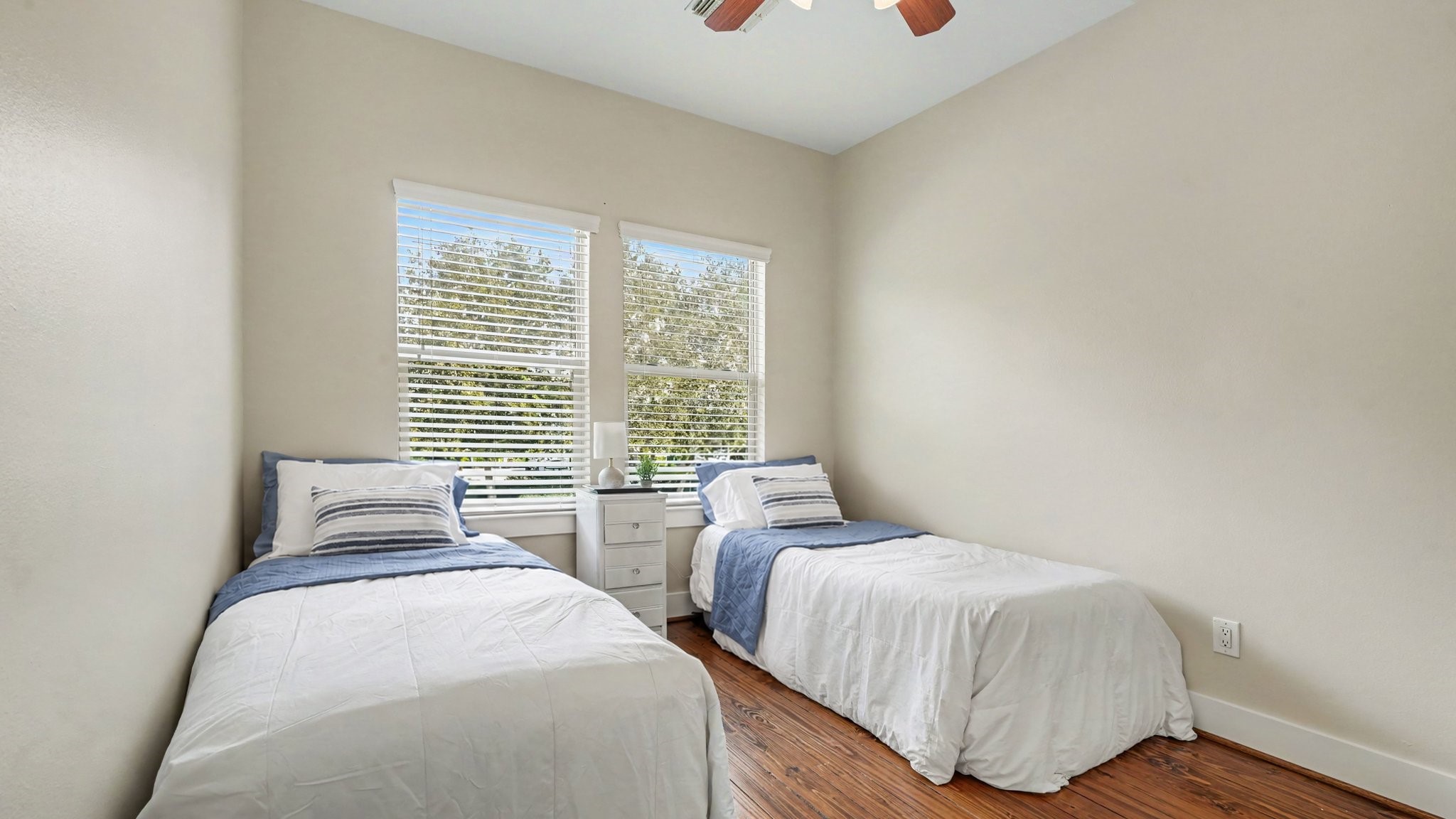 Third bedroom on second floor with ceiling fan and walk-in closet