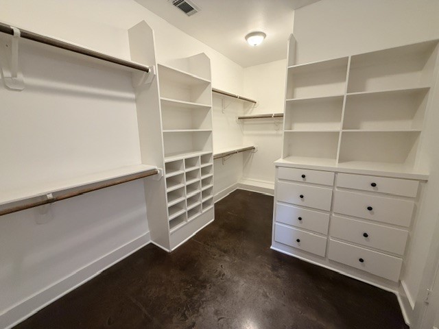 Welcome to the closet of your dreams with built-in drawers and shelves, with plenty of hanging space!