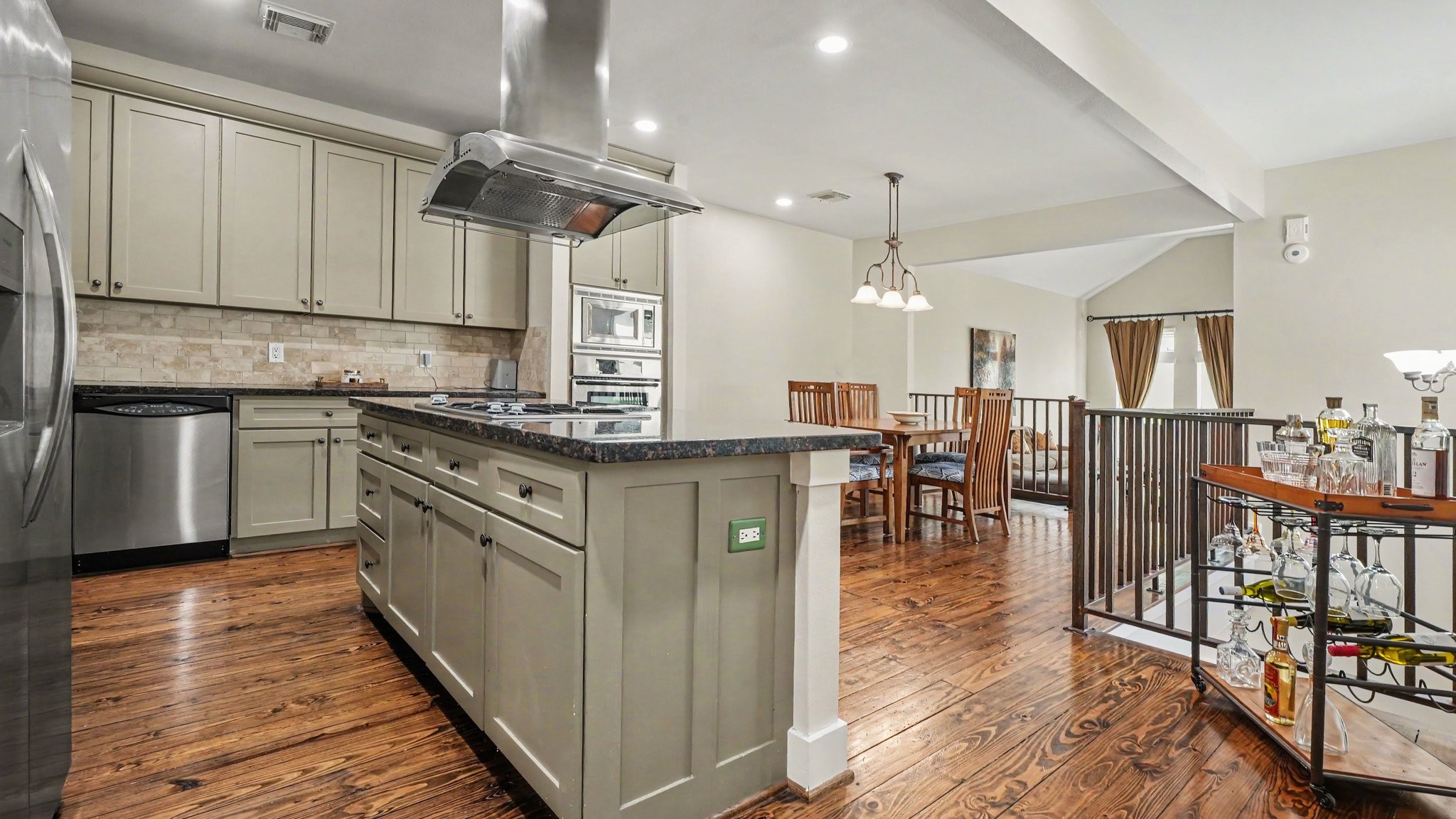 This view shows again how seamlessly the kitchen and dining room flow together, with the living room just beyond this floor plan is so inviting and open.