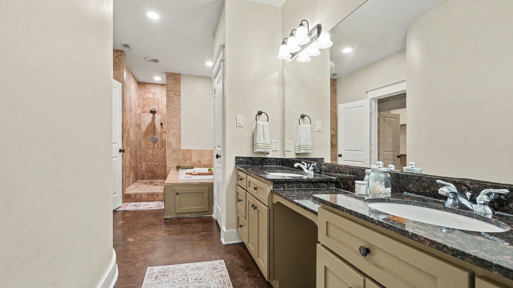 Primary ensuite bathroom with dual sinks, jetted tub and fabulous walk in shower