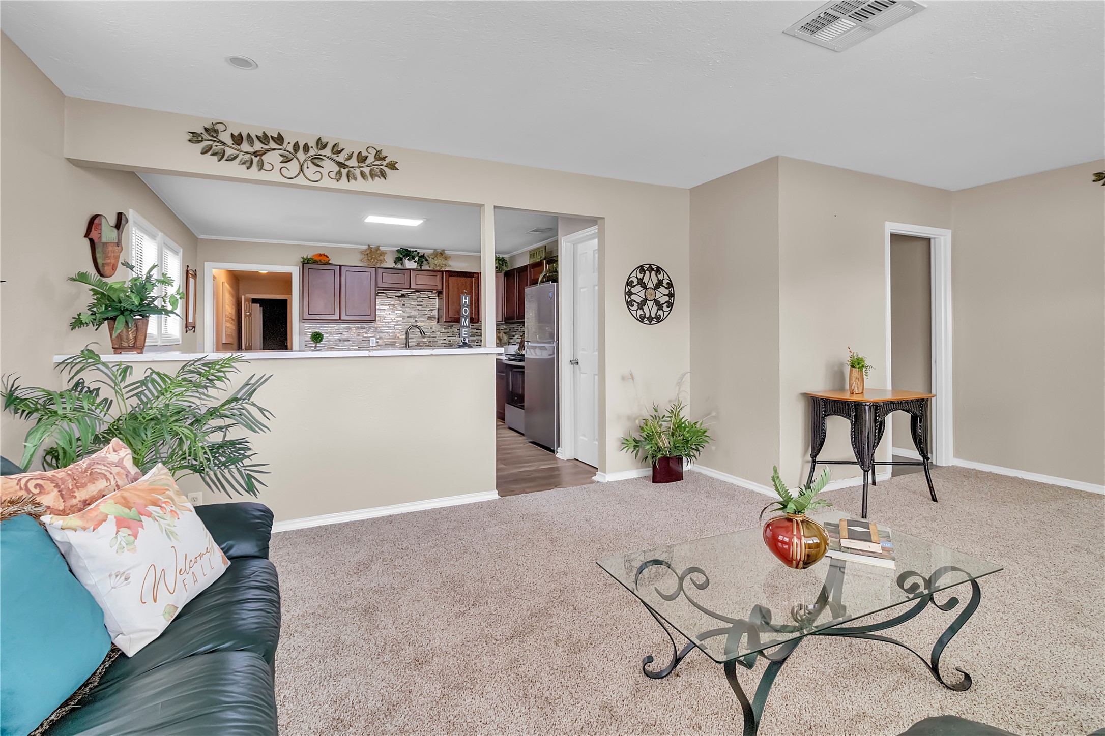 Open living area flows comfortably into the kitchen, creating a functional layout for everyday living and entertaining. Open living area flows comfortably into the kitchen, creating a functional layout for everyday living and entertaining.
