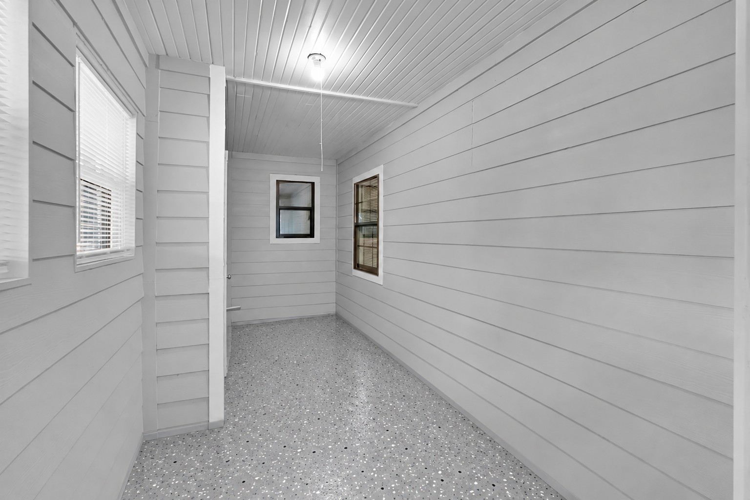 Flex Room / Sunroom View: Accessible through French doors from the primary bedroom you will find this enclosed sunroom that offers additional flex space for relaxing, hobbies, storage, or a future sitting area. Flex Room / Sunroom View: Accessible through French doors from the primary bedroom you will find this enclosed sunroom that offers additional flex space for relaxing, hobbies, storage, or a future sitting area.