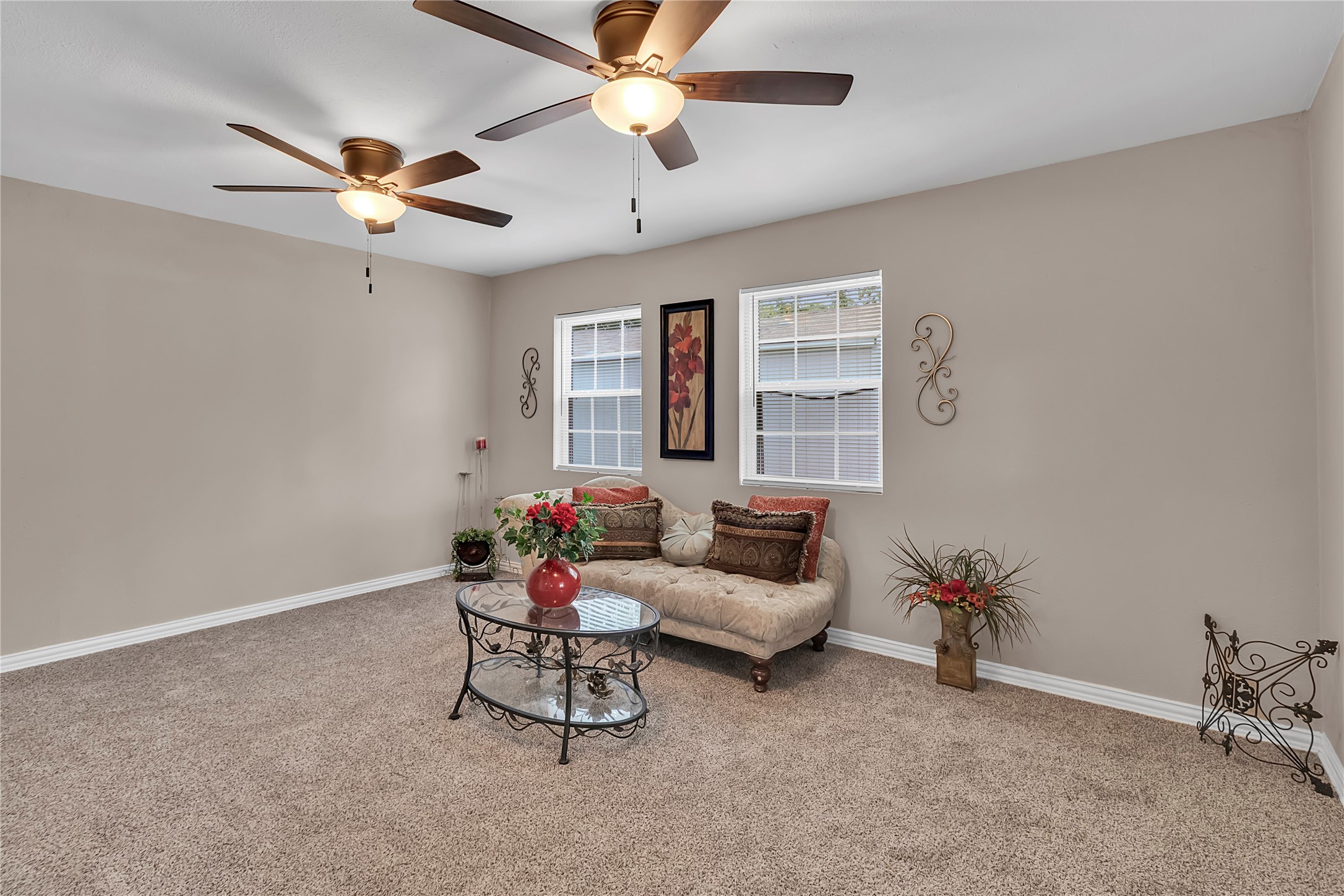 Spacious primary with fresh carpet, abundant natural light, and dual ceiling fansperfect for relaxing after a busy day. This desirable split floor plan provides added privacy, with the primary suite thoughtfully separated from the secondary bedrooms. Spacious primary with fresh carpet, abundant natural light, and dual ceiling fansperfect for relaxing after a busy day. This desirable split floor plan provides added privacy, with the primary suite thoughtfully separated from the secondary bedrooms.