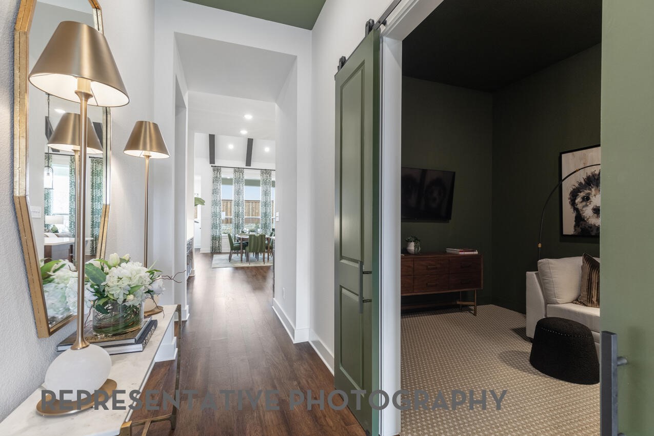 Welcoming entry foyer with elevated ceilings and a long sightline into the heart of the home.