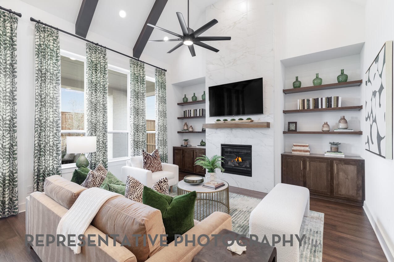 Spacious open-concept family room with expansive windows and abundant natural light. Spacious open-concept family room with expansive windows and abundant natural light.