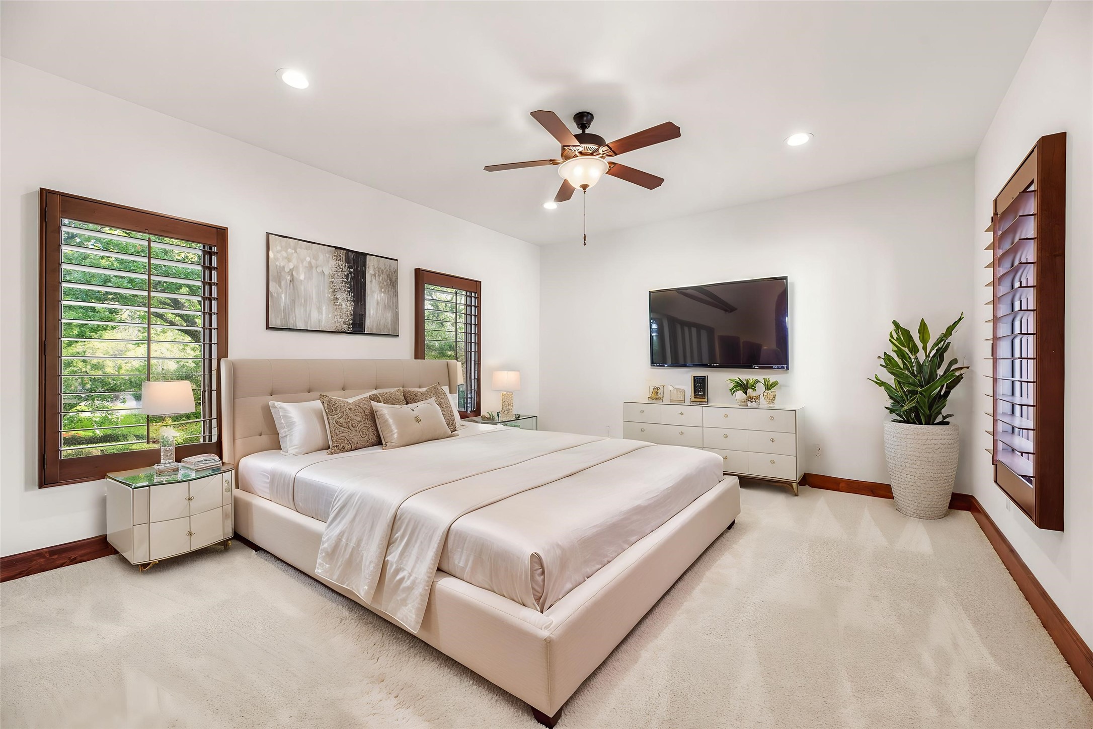 Secondary bedrooms are generously sized with plush carpeting and large windows, providing a practical and comfortable retreat for guests or family. Virtually staged.
