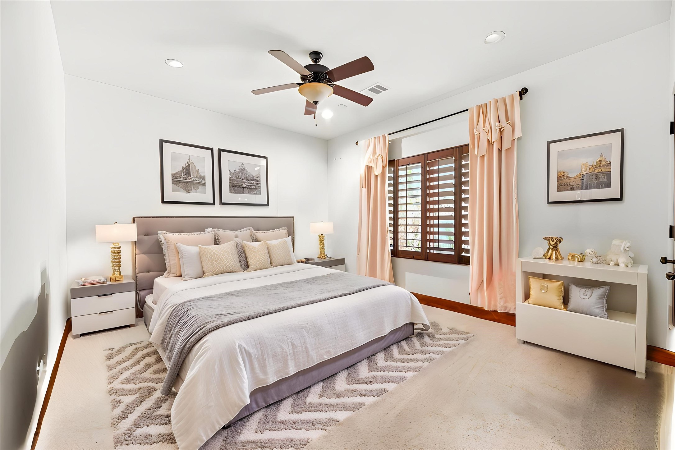 This secondary bedroom offers a bright and airy feel, showcasing the home's efficient use of space and consistent design. Virtually staged.