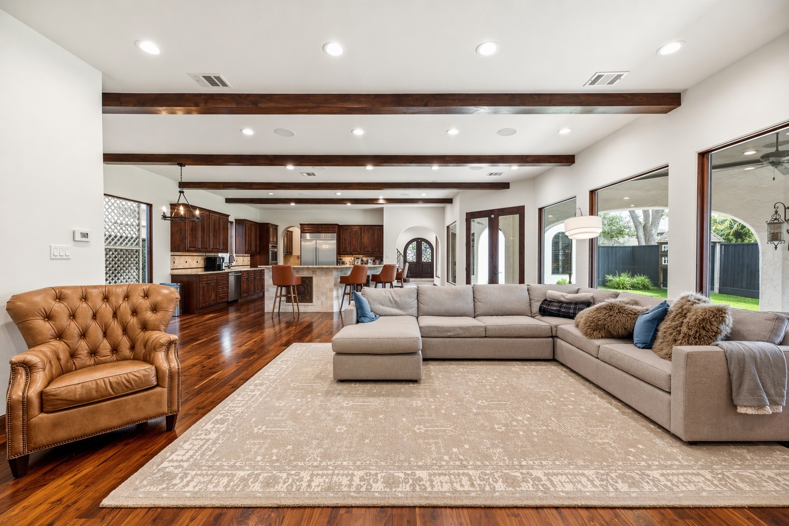 This alternative view of the living room highlights the open-concept layout and custom woodwork, offering a perfect perspective of how the space connects to the heart of the home. This alternative view of the living room highlights the open-concept layout and custom woodwork, offering a perfect perspective of how the space connects to the heart of the home.