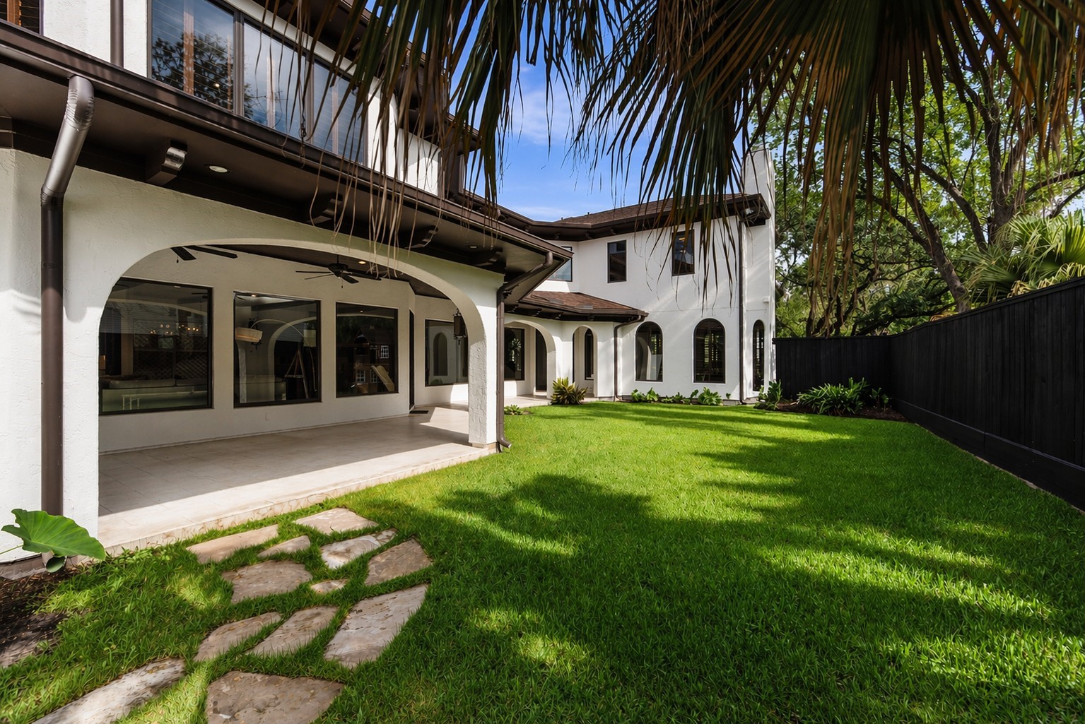 The fully fenced backyard offers a lush, private retreat perfect for recreation or peaceful afternoons in the sun.