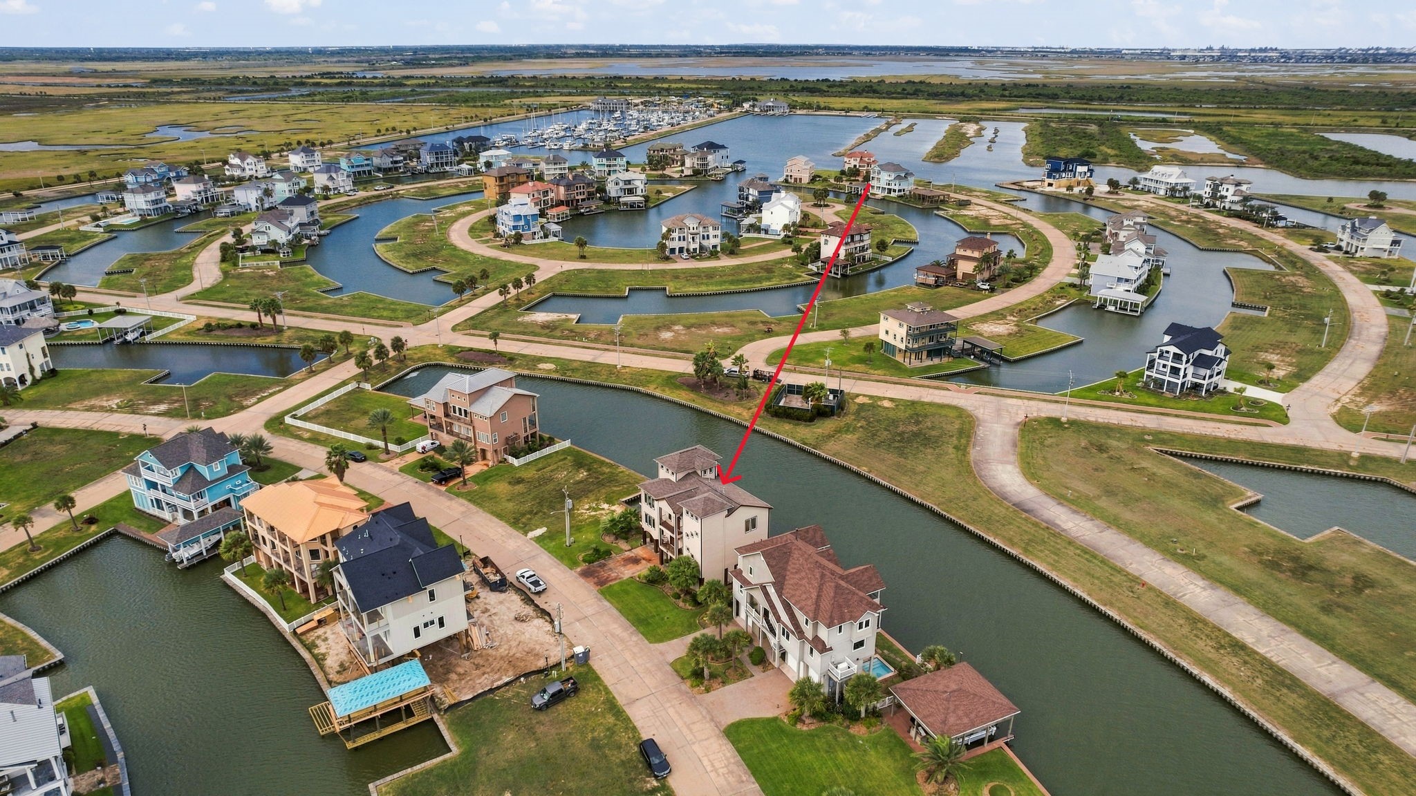 Stunning waterfront property nestled in a serene canal community, offering picturesque views and direct water access for a perfect coastal lifestyle.
