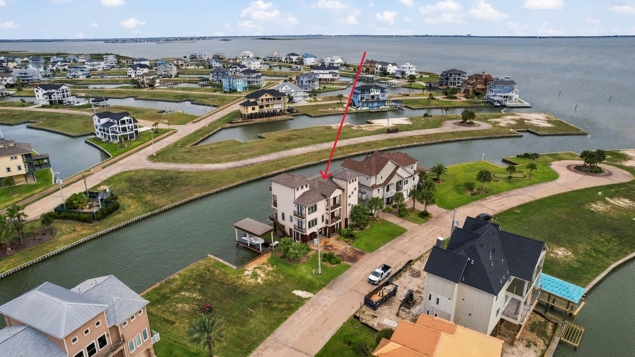 Stunning waterfront property located on a serene canal with direct access to expansive bay views, offering a perfect blend of luxury and tranquility.