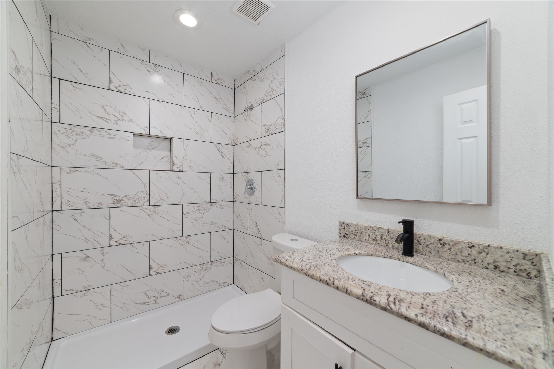 Another full bathroom with stand up shower.