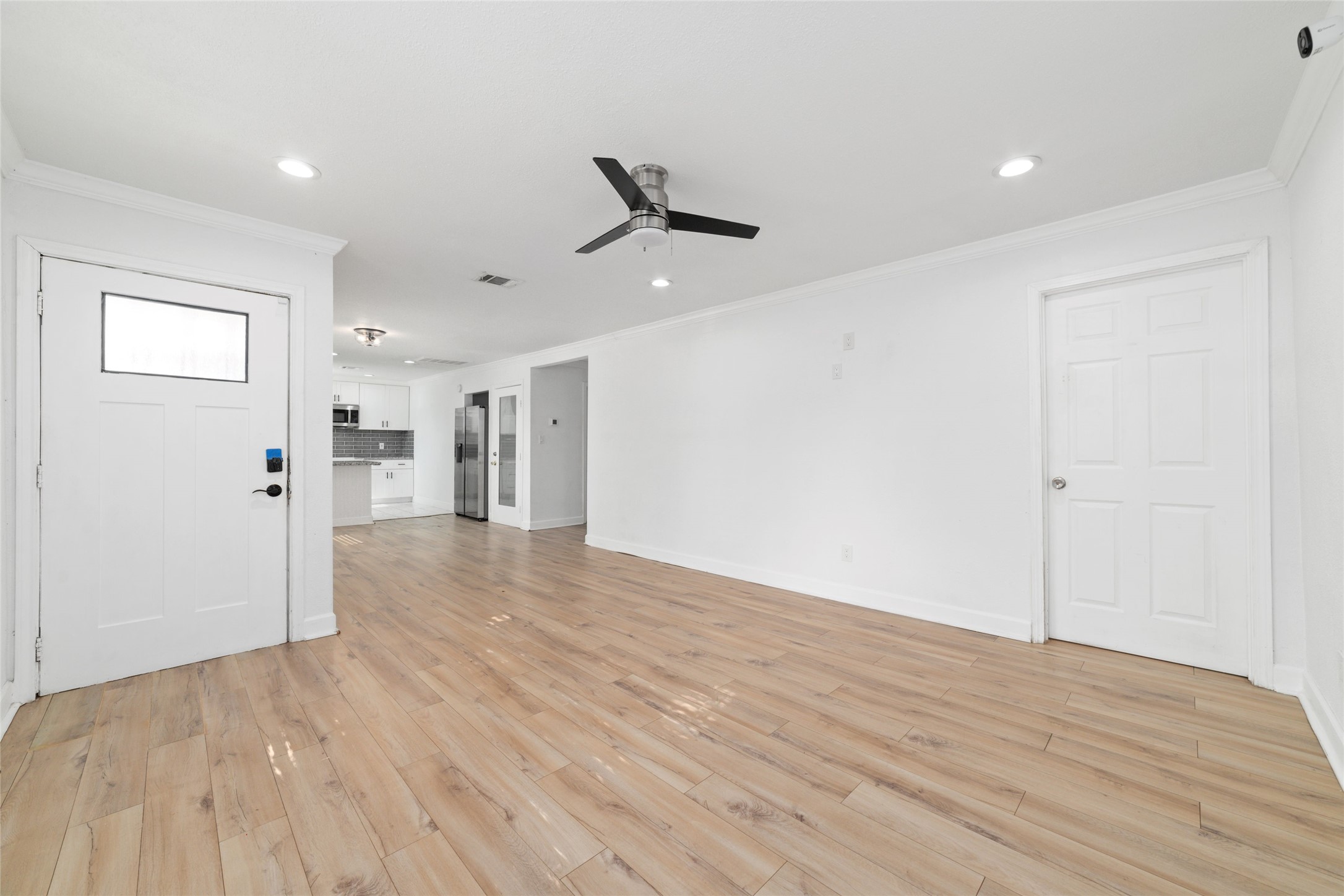 Just inside the front door, the closed door to the right is a bedroom.
